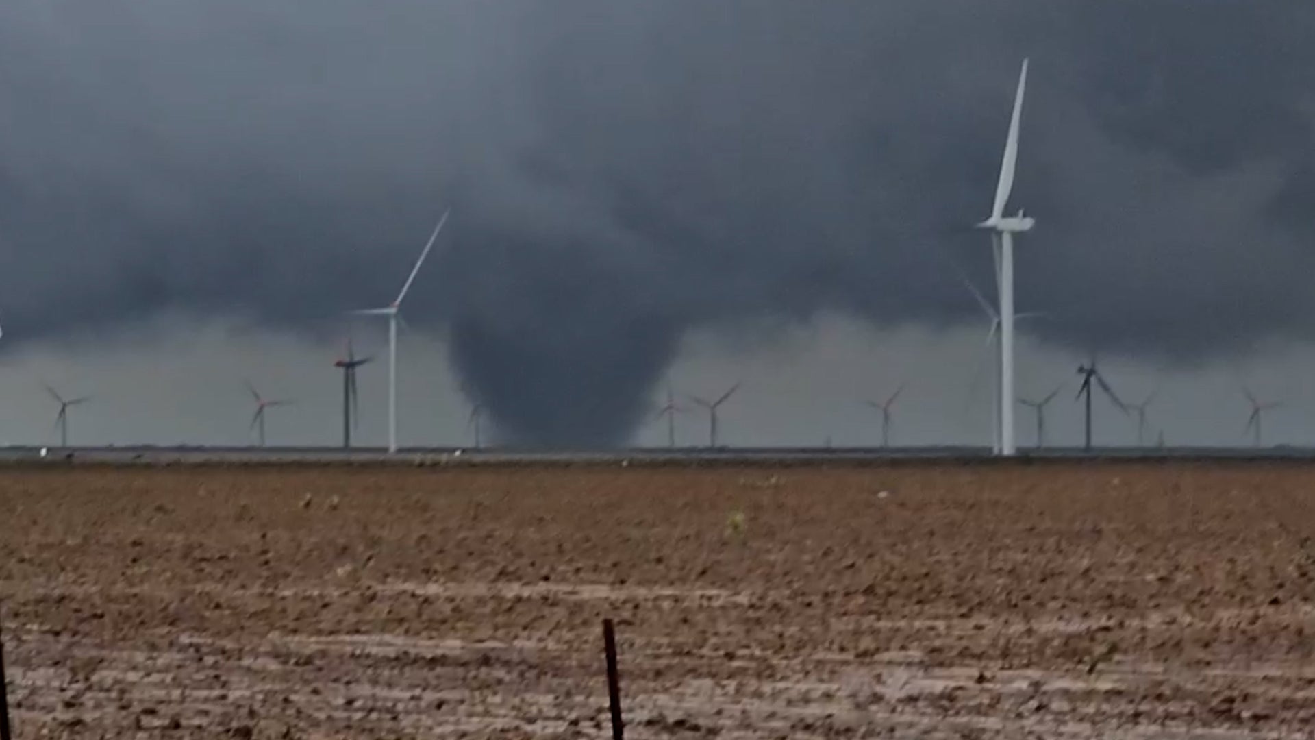 Tornado whirls between wind turbines in Texas Panhandle