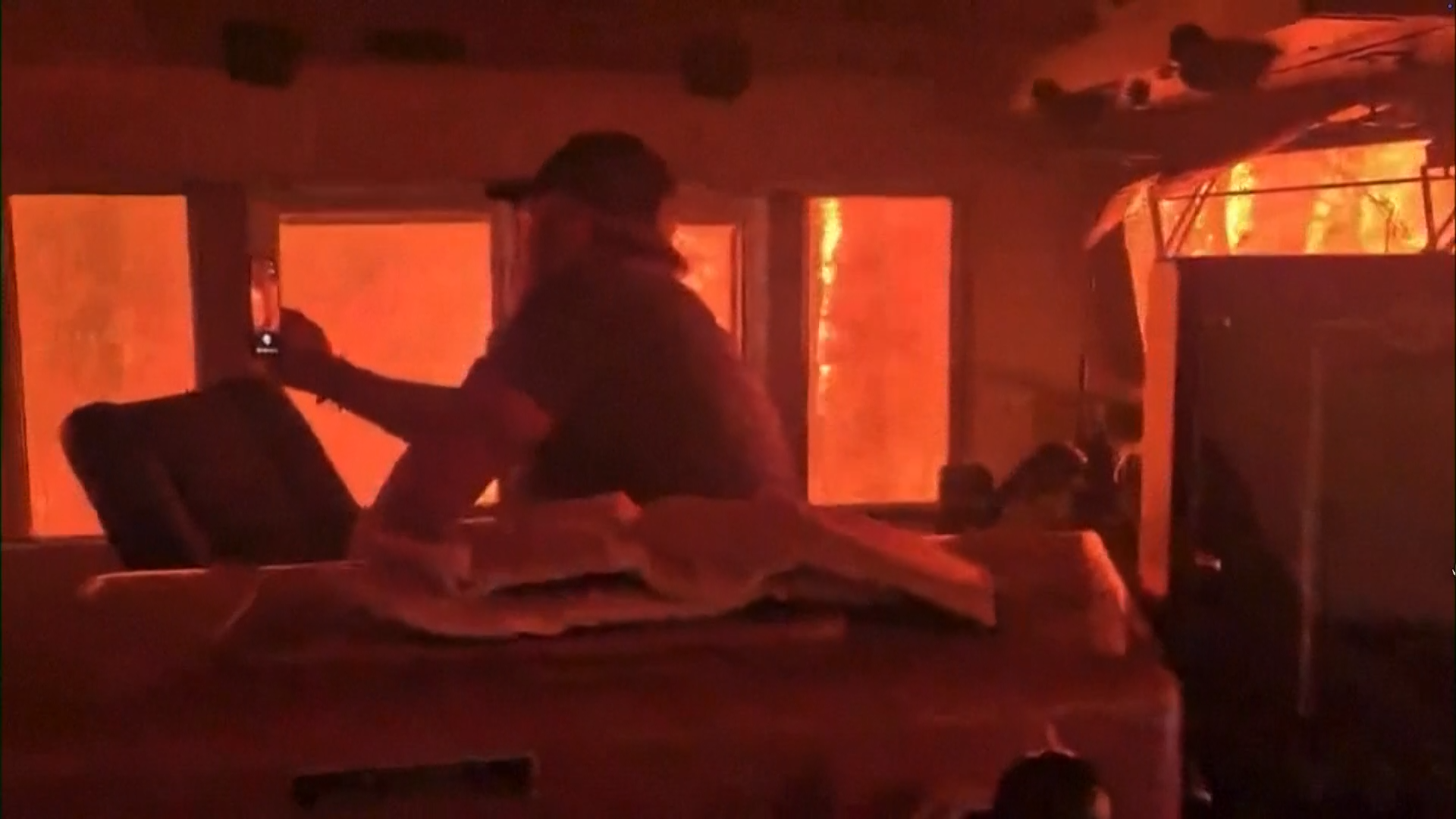 Watch: Ontario wildfire surrounds train crew on tracks