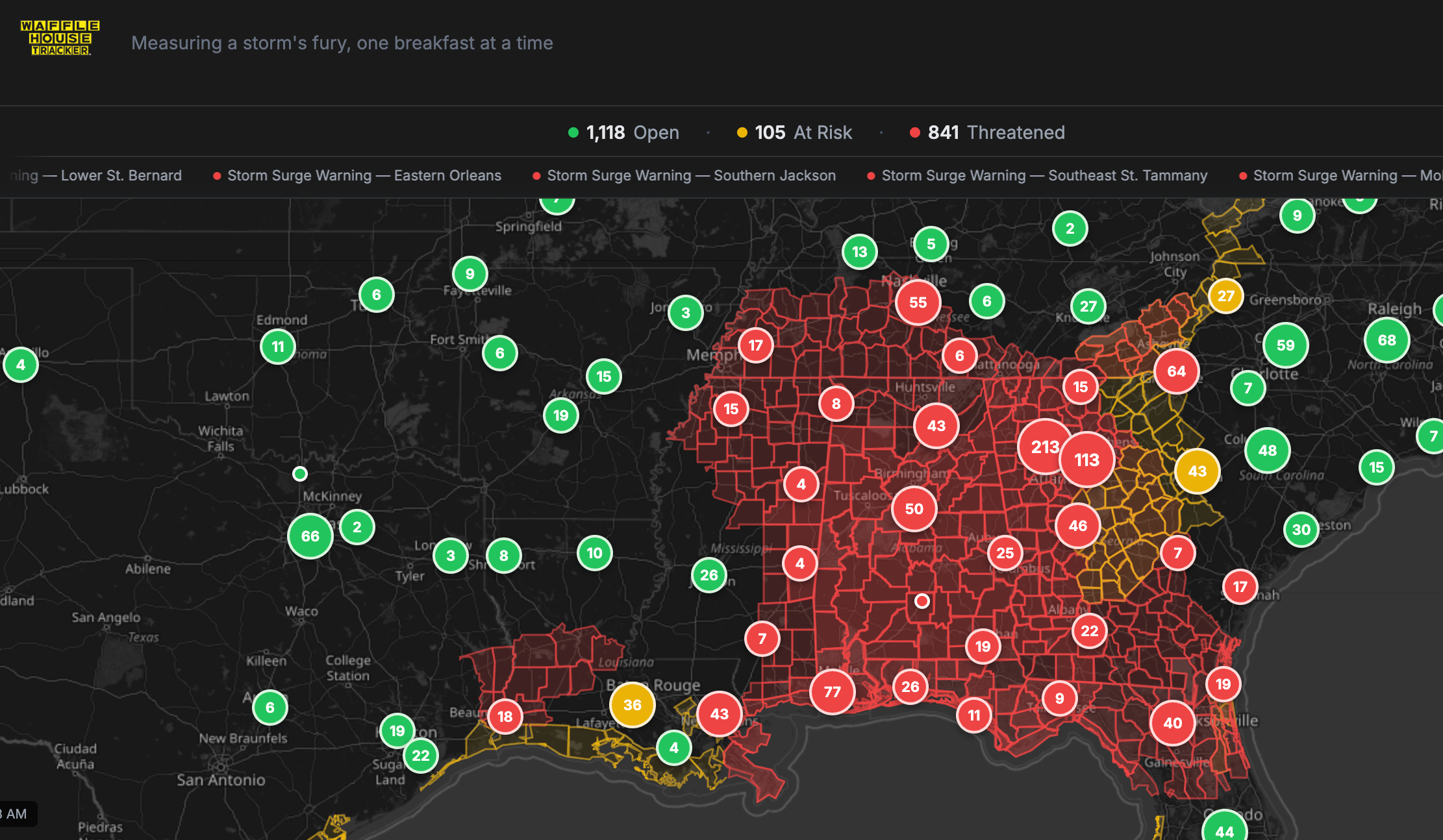 Map of the Southeast shaded red across Mississippi, Alabama and Georgia, with red circles marking Waffle Houses in warning areas.