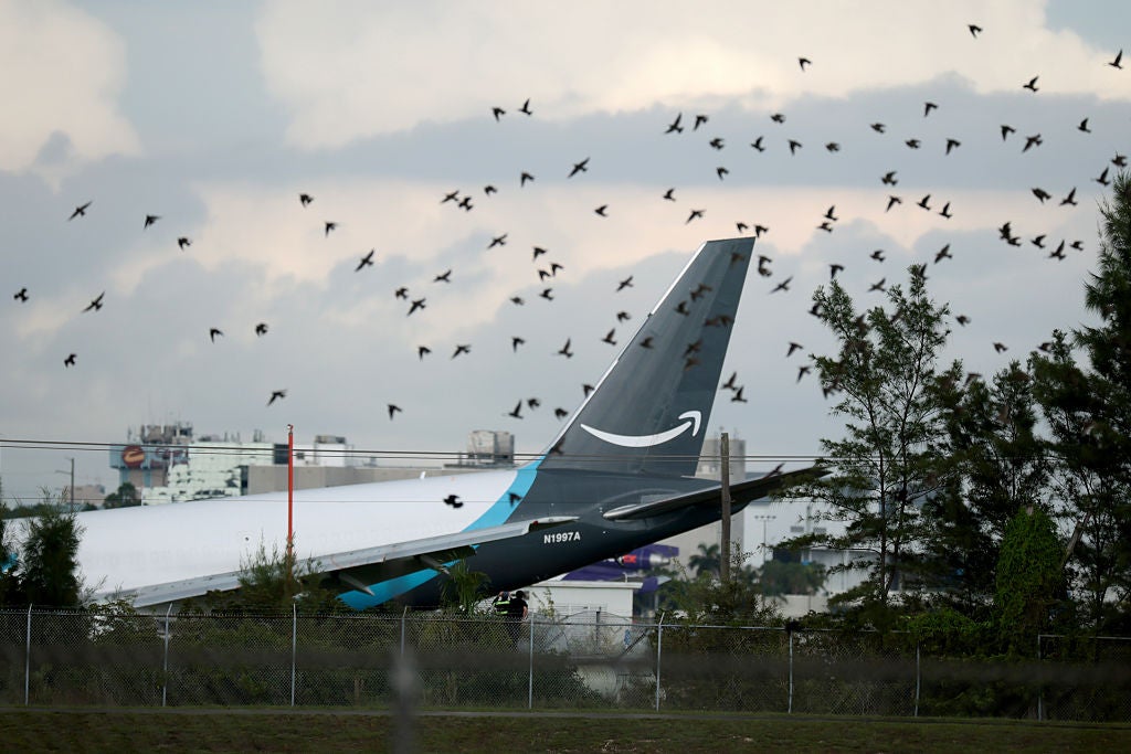 An Amazon cargo plane is seen after it crashed at Miami International Airport on September 06, 2026 in Miami, Florida. In a statement, the Federal Aviation Administration said Prime Air Flight 7598 overran the runway while landing around 2 p.m. after departing from Luis Mu&ntilde;oz Mar&iacute;n International Airport in San Juan, Puerto Rico, earlier today.
