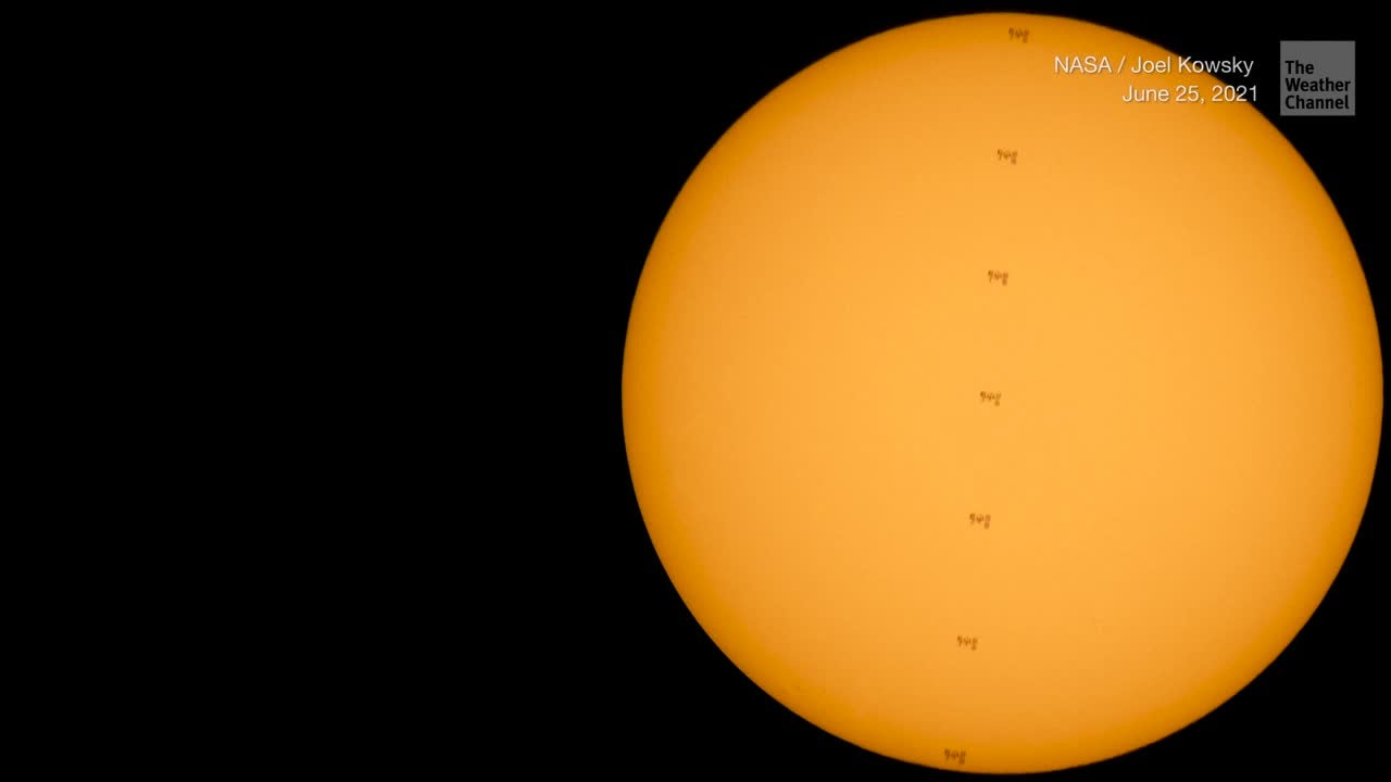 Astronauts Captured Traversing the Sun on the International Space Station