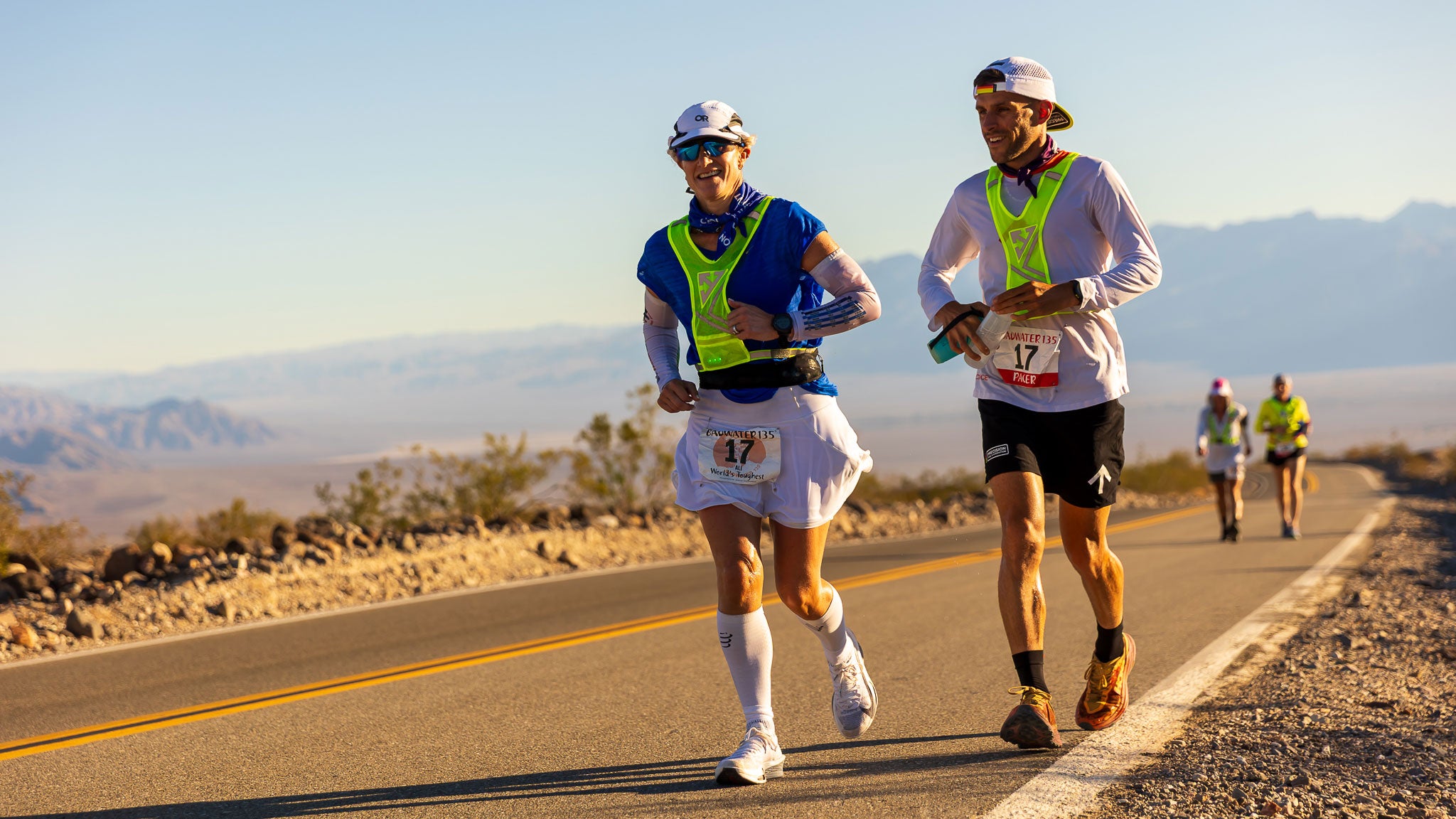 A participants in the 2025 Badwater 135 Ultramarathon, alongside a pacer who provide supplies as well as moral support along the strenuous run.