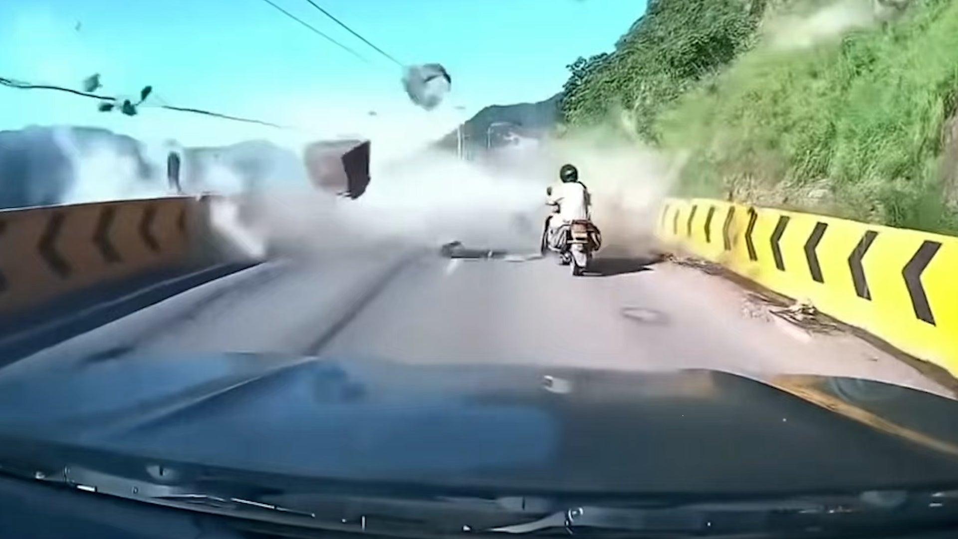 Rain-fueled rockfall slams car on China mountain highway