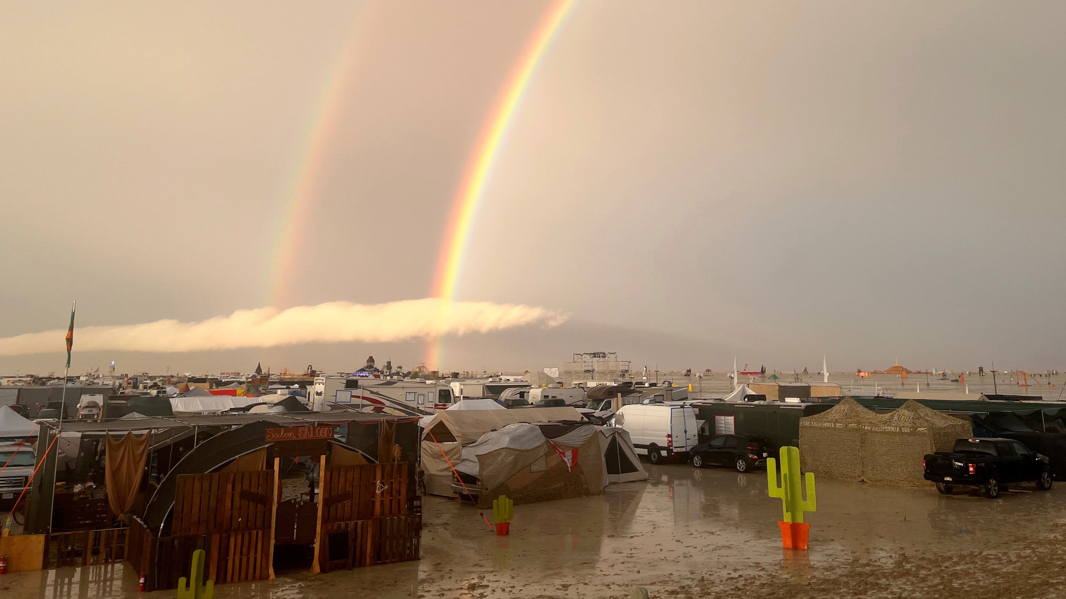 A rainbow seen over the muddy grounds of the Burning Man festival on September 4, 2023. Tens of thousands of visitors to the desert festival were stranded on the site in Nevada after heavy rainfall. 