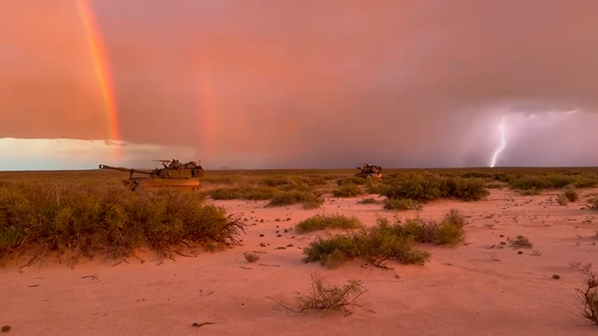 Double rainbow, lightning light up desert sky as Army rolls through