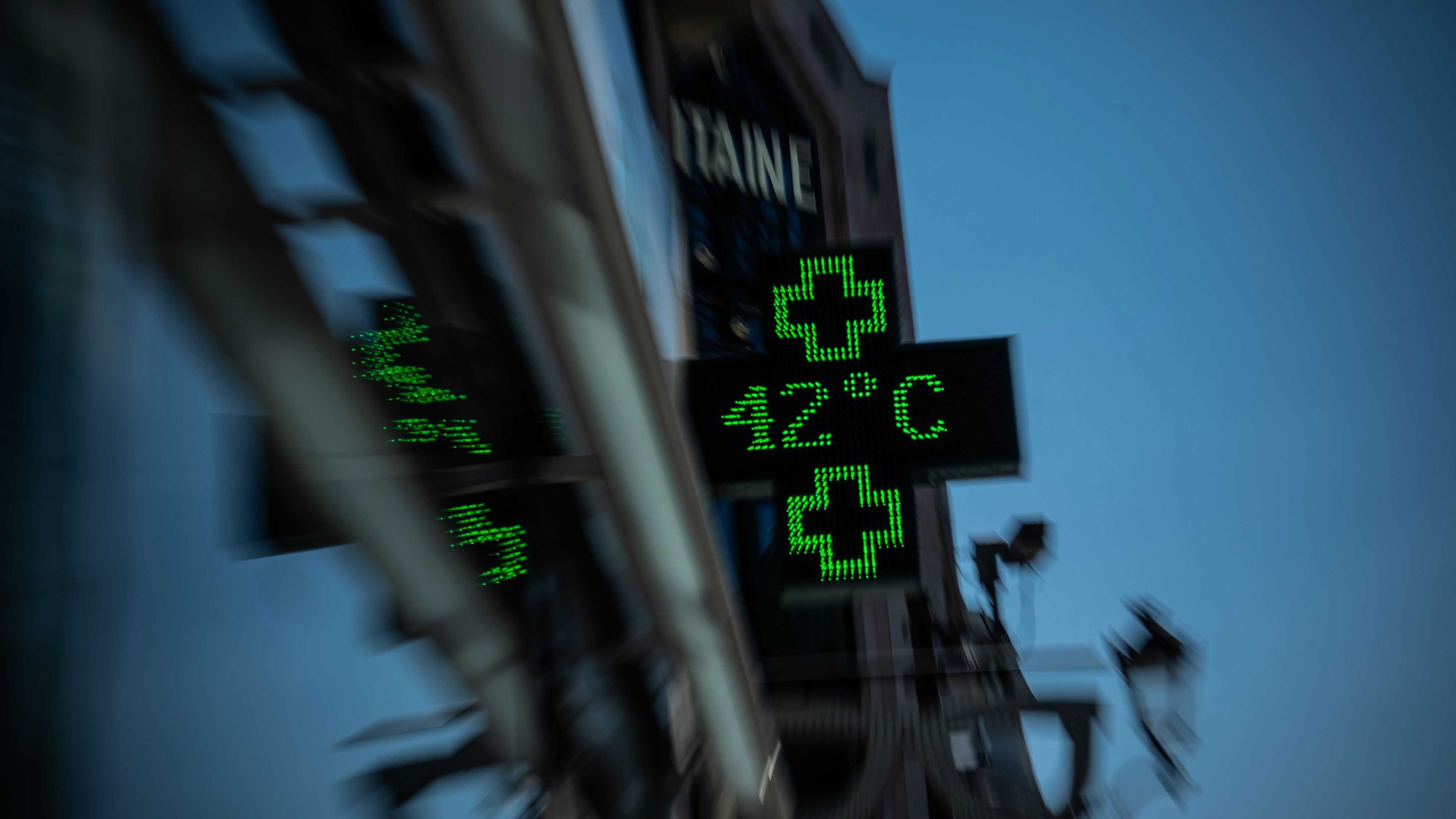 A pharmacy display shows a temperature of 42 degrees Celsius (107.6 degrees Fahrenheit) in Paris during a heat wave, on Wednesday, July 29, 2026.