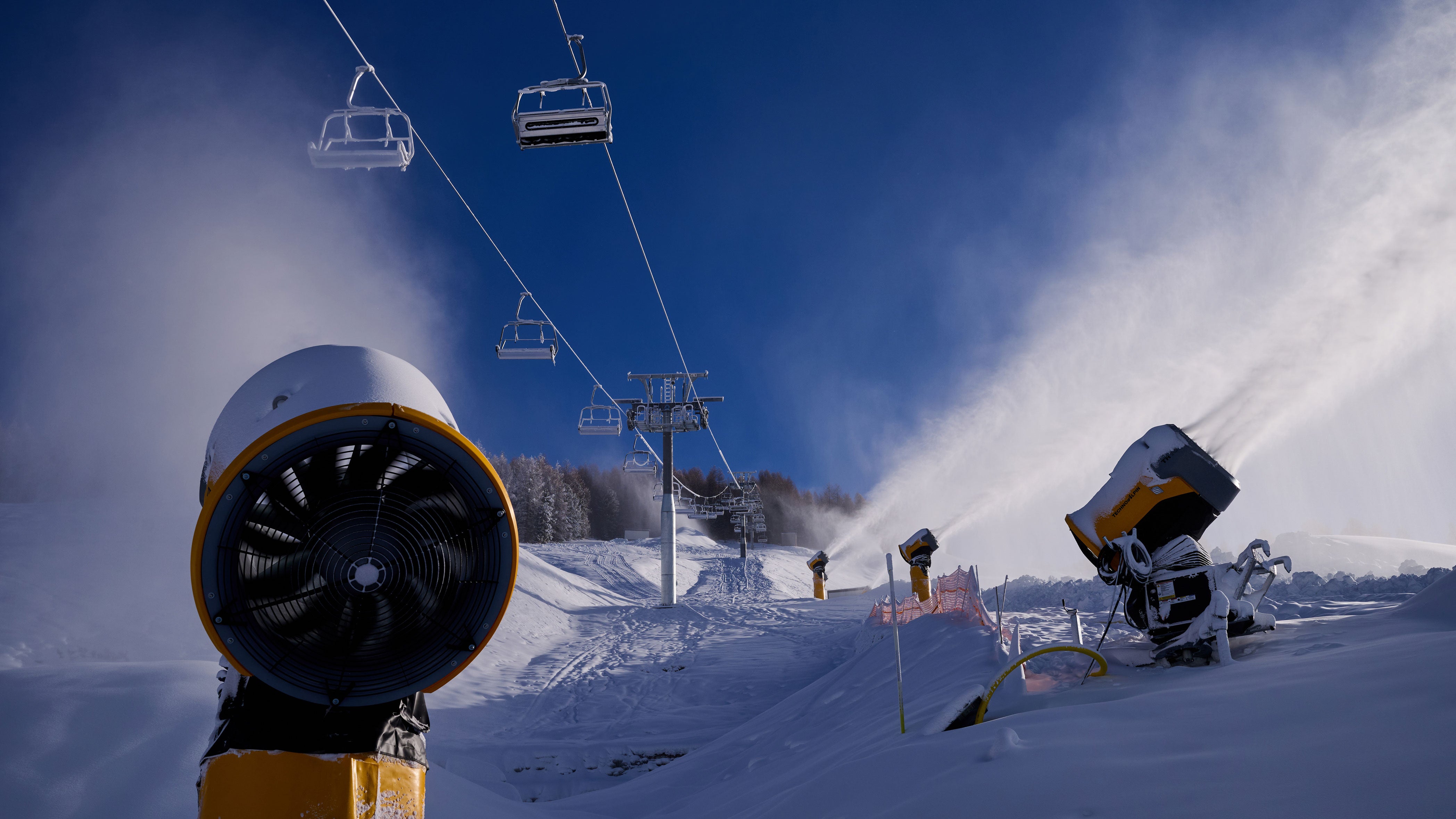 The construction of ski slopes and ski jumps with snow cannons on December 26, 2025, in Livigno, Italy, for the Milano Cortina 2026 Winter Olympics &mdash; which hosts men's alpine skiing, snowboard, freestyle skiing and ski mountaineering competitions.