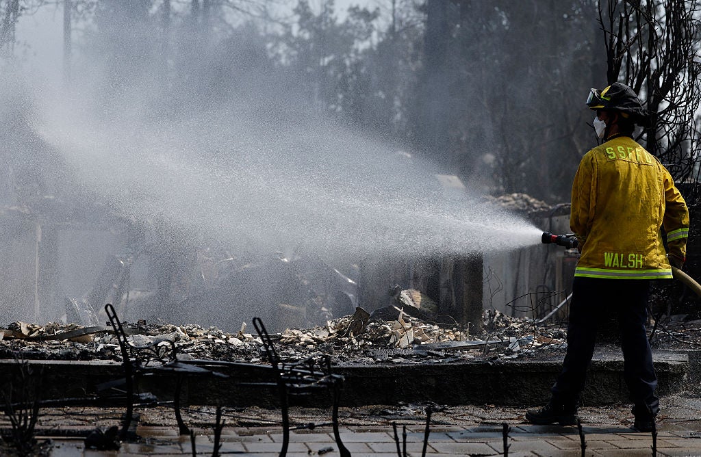 A firefighter works the Old Trails Fire in Spokane, Washington &mdash; August 6, 2026. Over 10,000 acres burned, 700+ structures destroyed, and 65,000 residents evacuated in one of the most destructive fire events of the season.