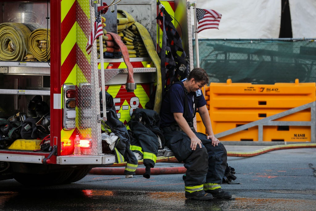 A firefighter takes a brief rest between operations. Across the country this wildfire season, heat exhaustion has become the fastest-rising injury on the fireline.