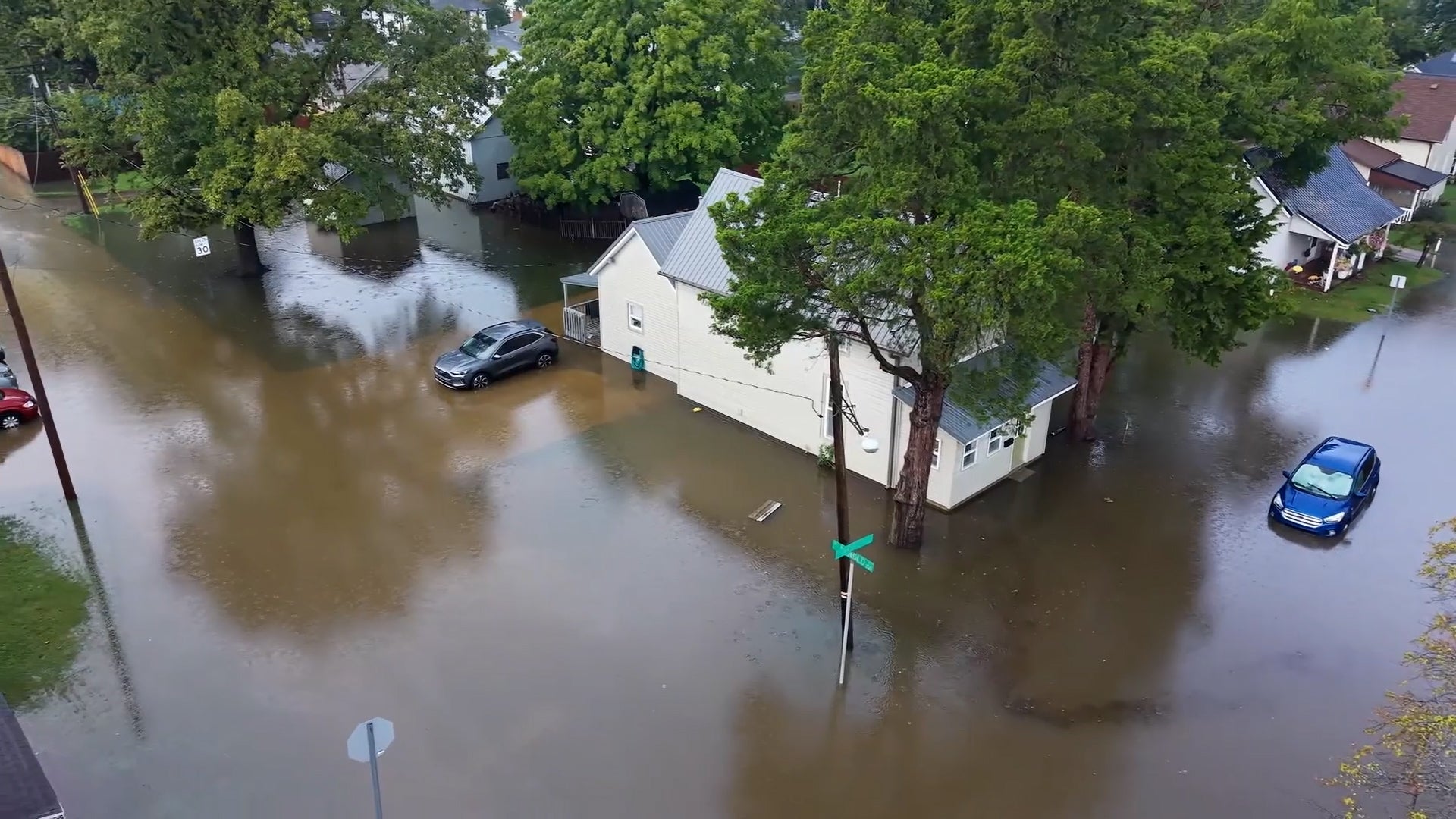 Drone video: Heavy rain turns Indiana neighborhood roads into canals
