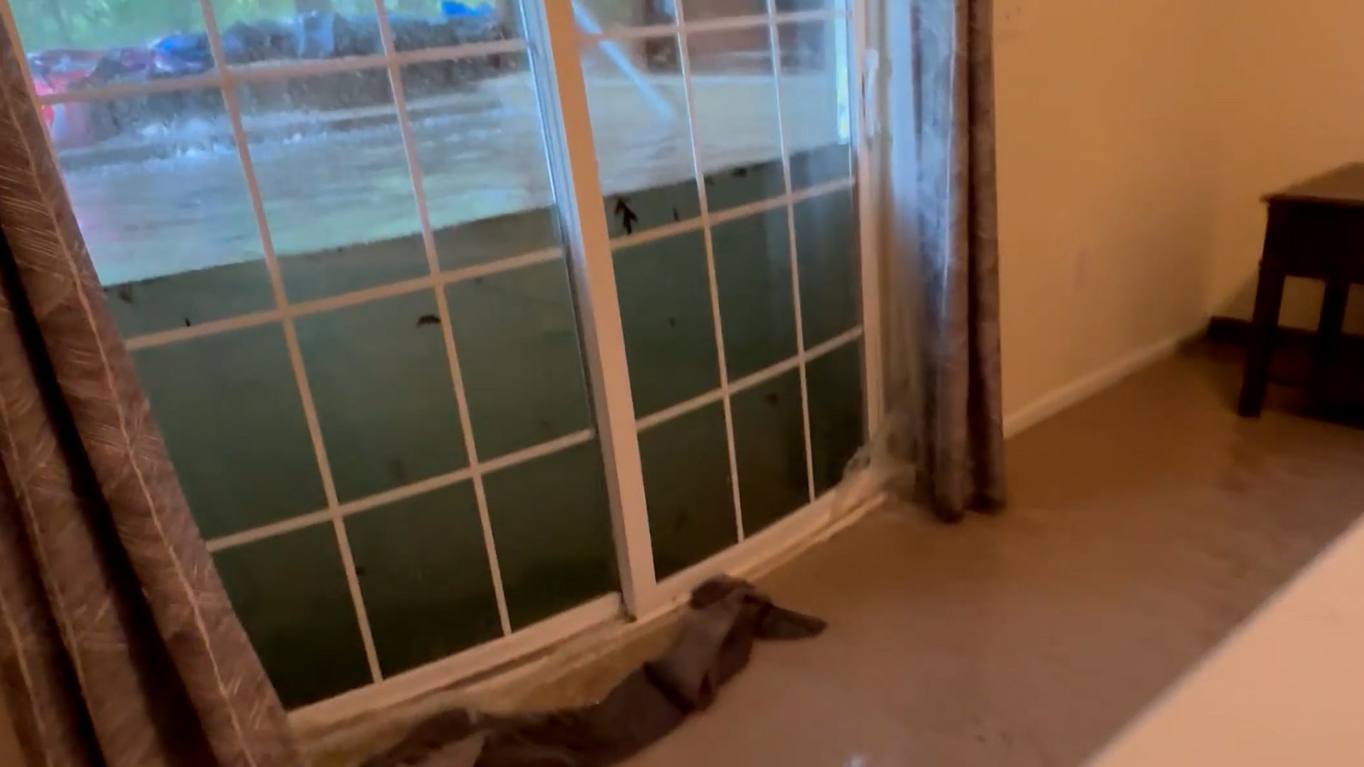 Floodwaters break down doors, sending wave through home