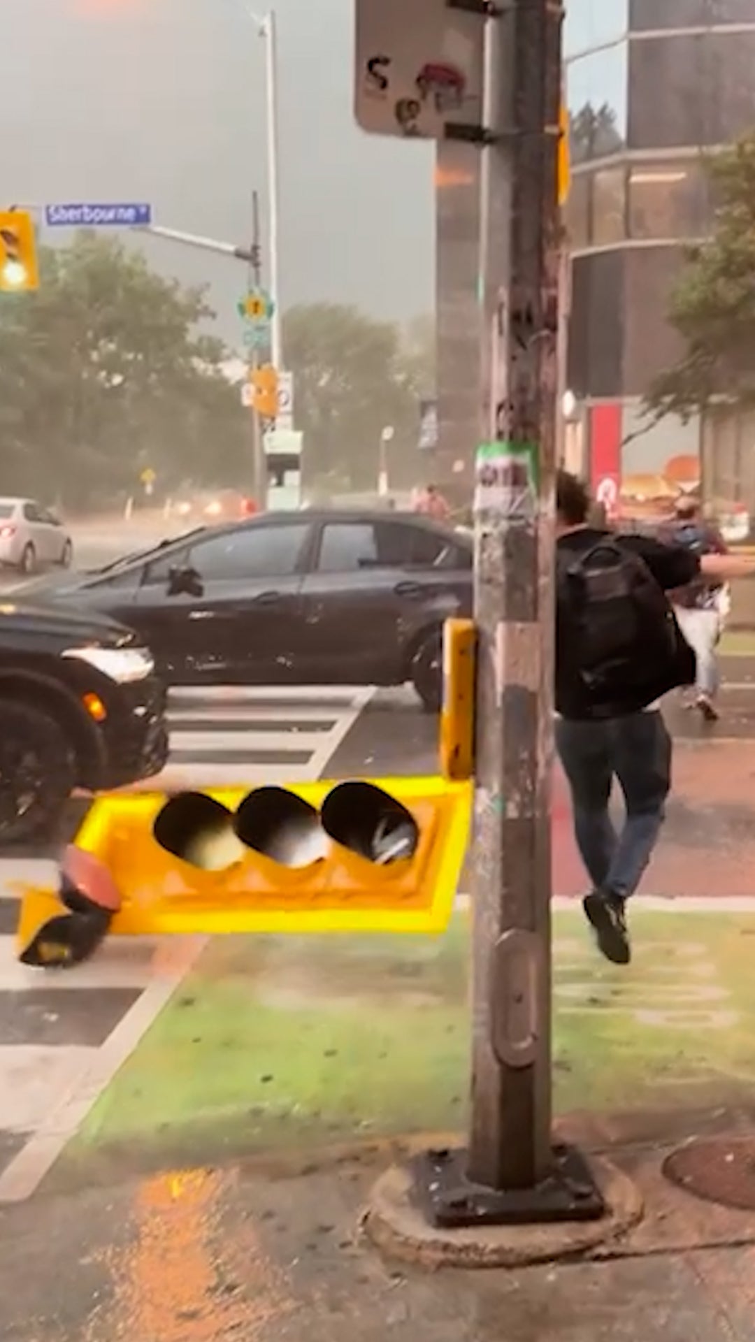 Wild wind whips Toronto pedestrians