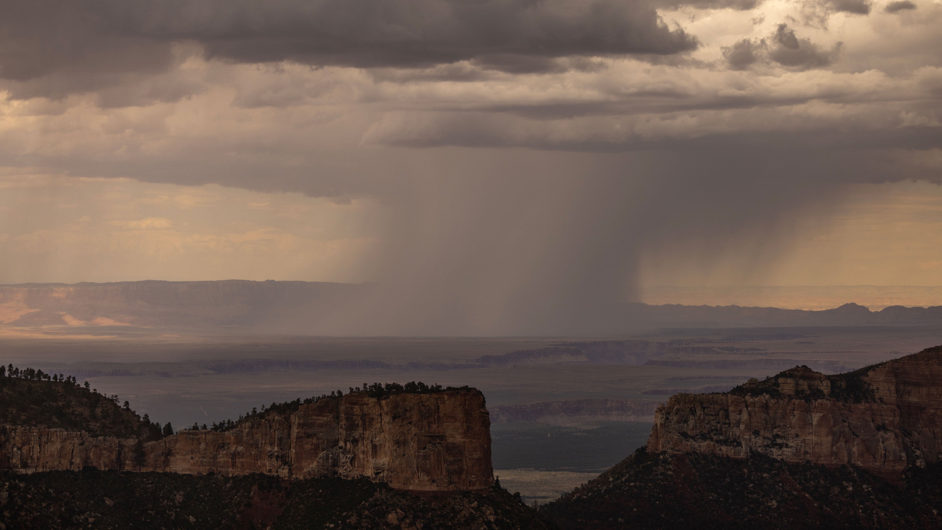 Monsoonal weather brings rain to the desert near Point Imperial on August 21, 2024 at the North Rim of Grand Canyon National Park, Arizona. A shift in wind direction from westerly to southerly typically triggers the American Southwest monsoon by mid-June and runs through September, bringing storms of often-spectacular cloudbursts that produce widespread flash floods and dangerous lightning. 