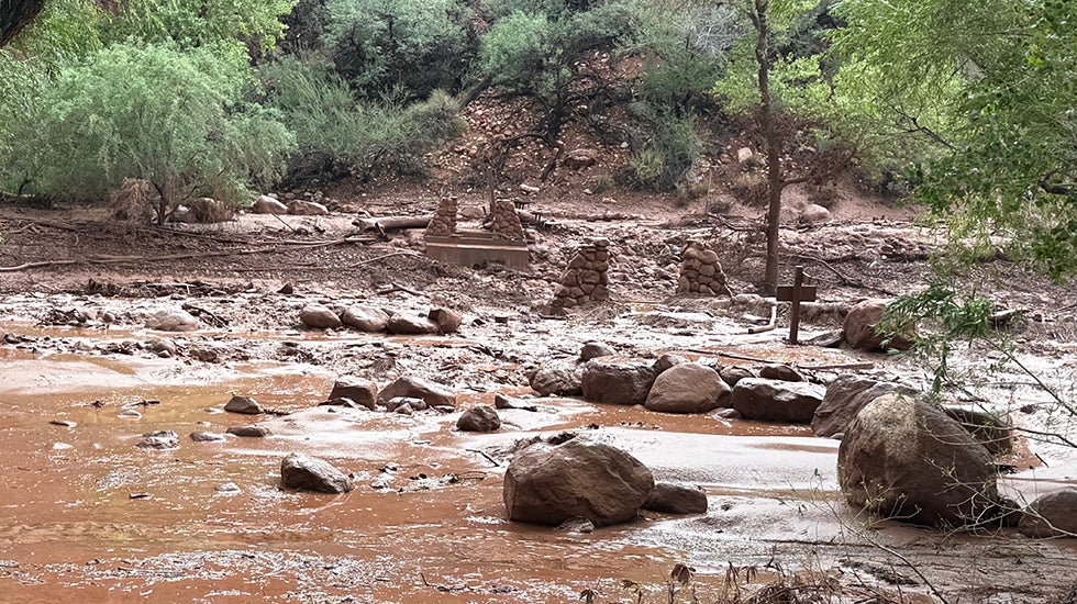 Stacked stone pylons left after a bridge was washed out.