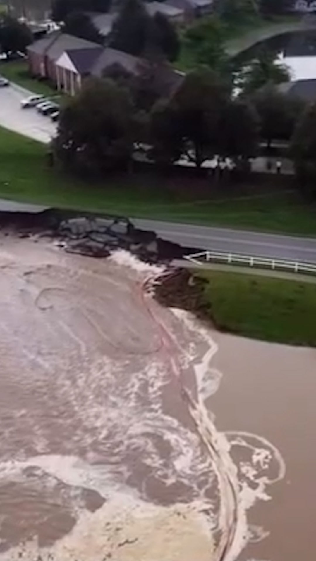 Indiana road collapses in flooding