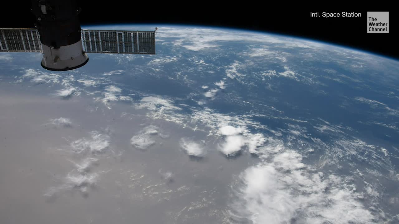 ISS Soars Over Solar Eclipse and Saharan Dust on Summer Solstice