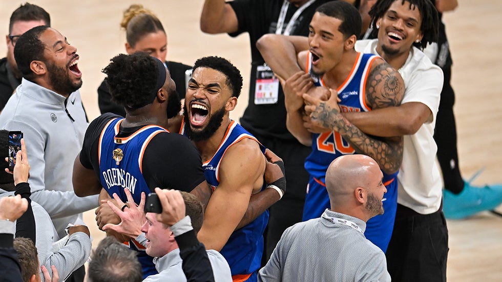 basketball players celebrate a championship win