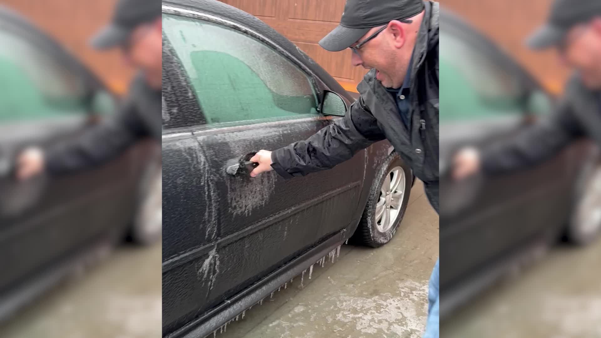 Man Tries And Fails To Open Frozen Car Door