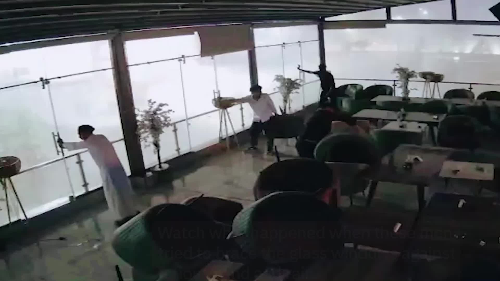 Men Flee As Storm Destroys Glass Windows