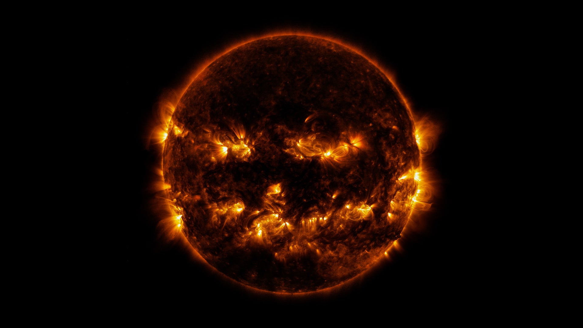 NASA Shares Spooky Image of Jack-O’-Lantern Sun