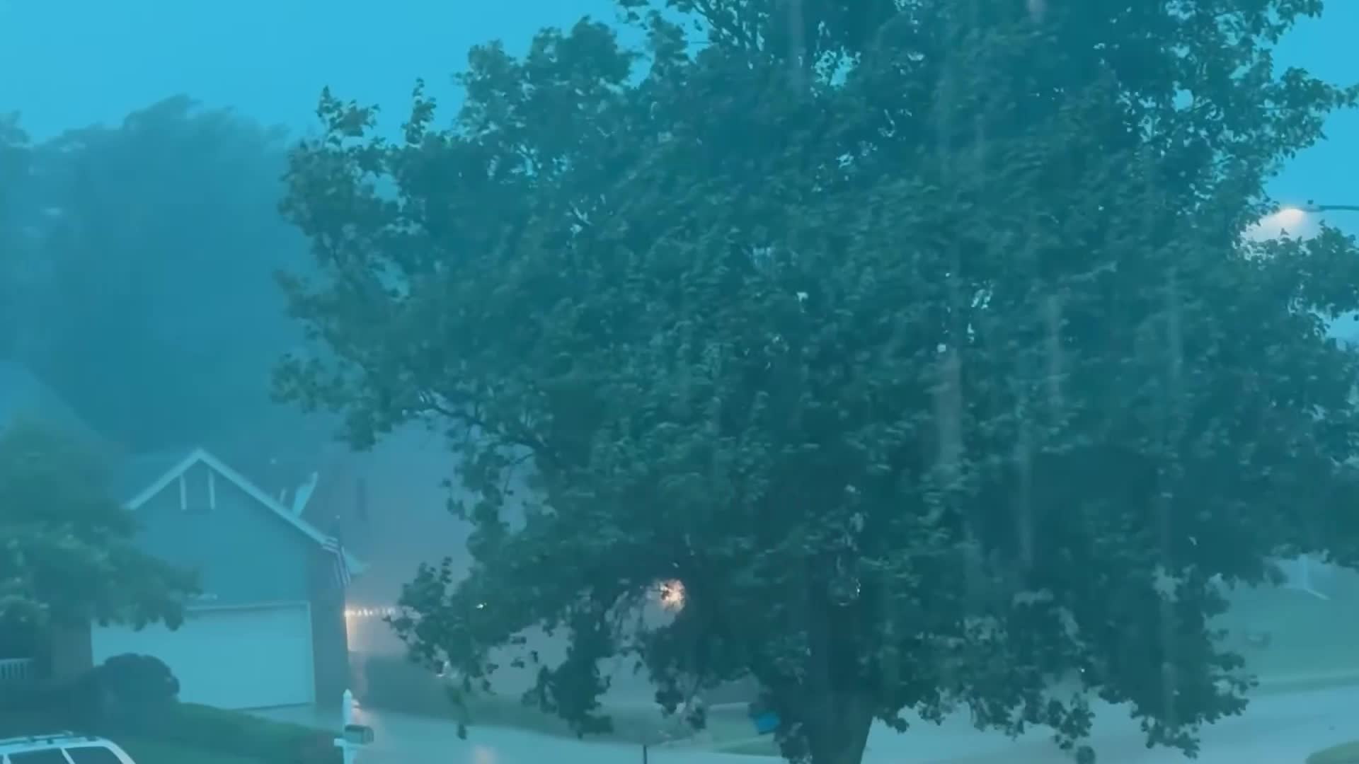 Nebraska Storms Send Tree Collapsing Onto Car