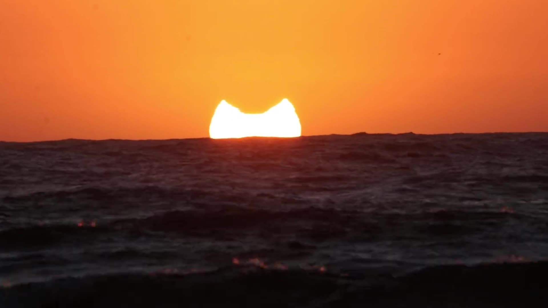 Partial Eclipse 'Takes a Bite' Out of Setting Sun