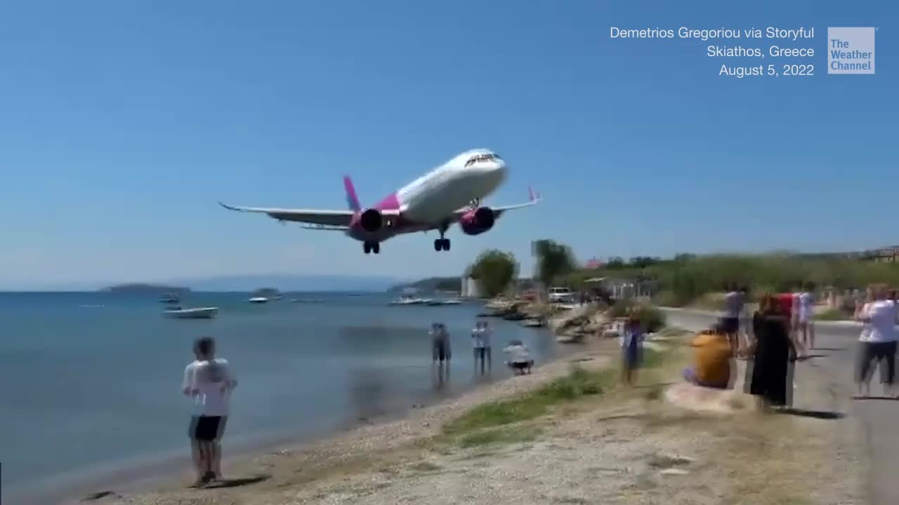 Plane Skims Spectators As It Lands