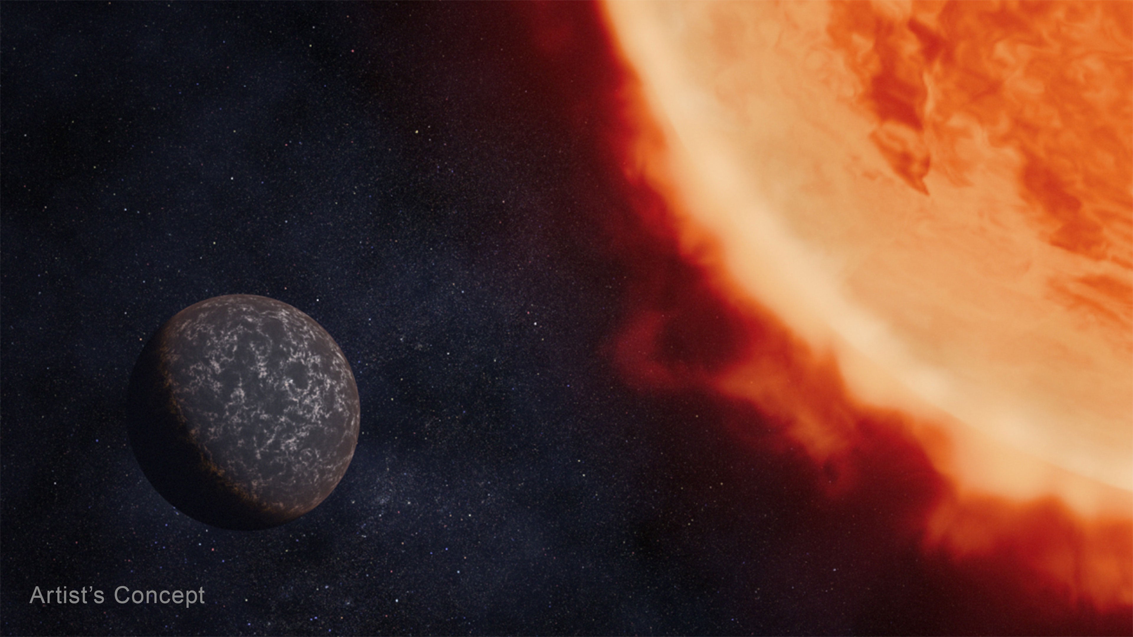 Artist&rsquo;s concept of a bare rocky planet orbiting a red dwarf star.  