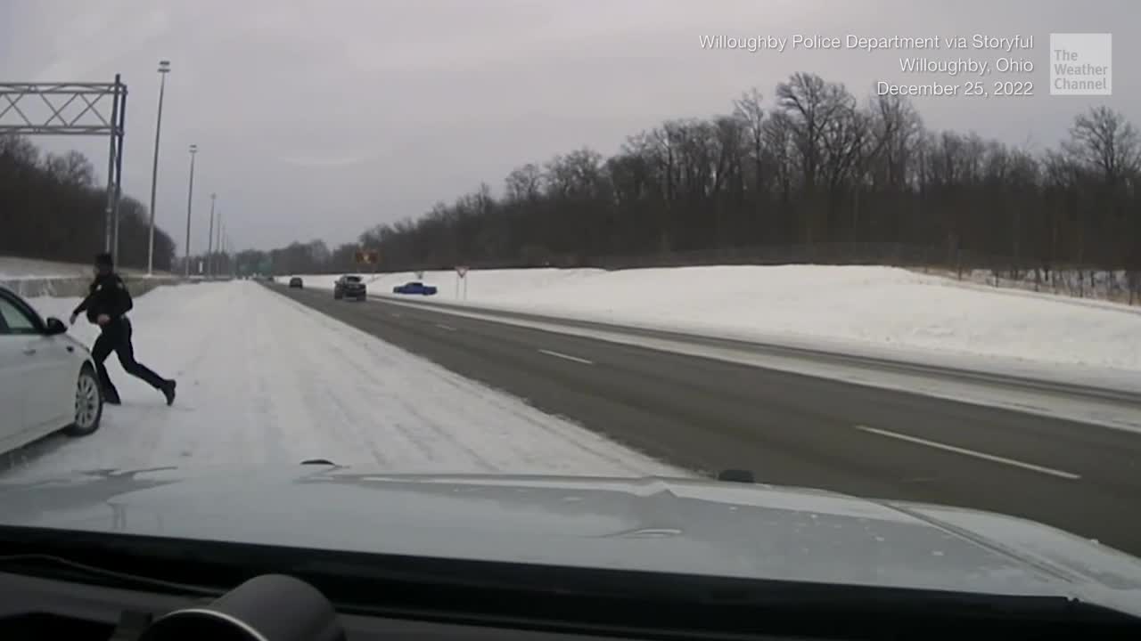 Police Officer Jumps From Road Just In Time To Avoid Disaster