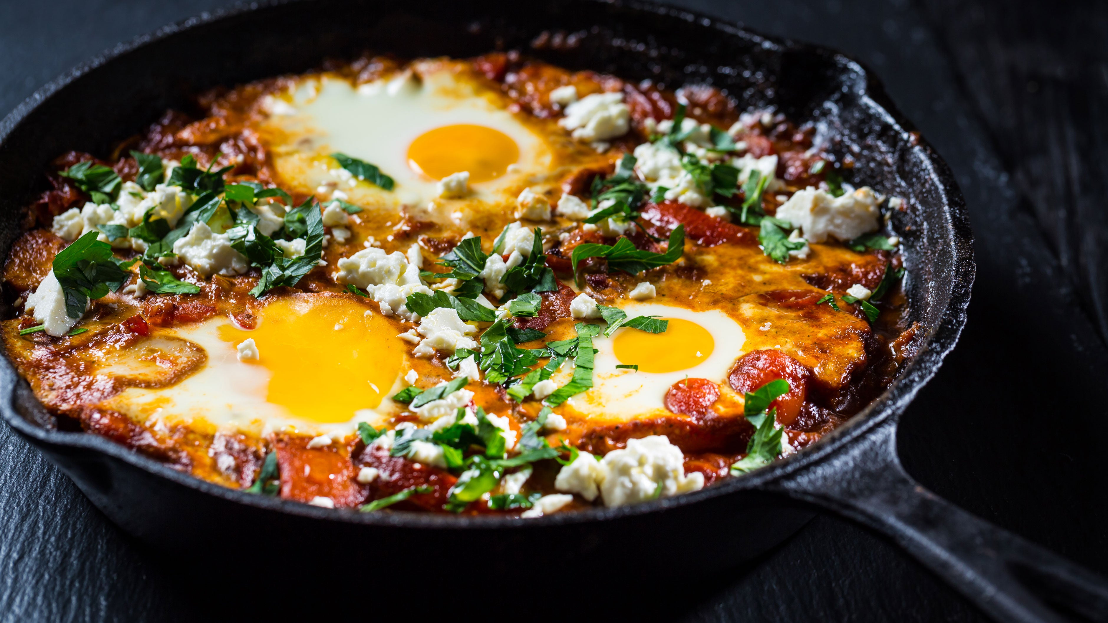 A spin on shakshuka: eggs simmered in a rich, spiced tomato sauce