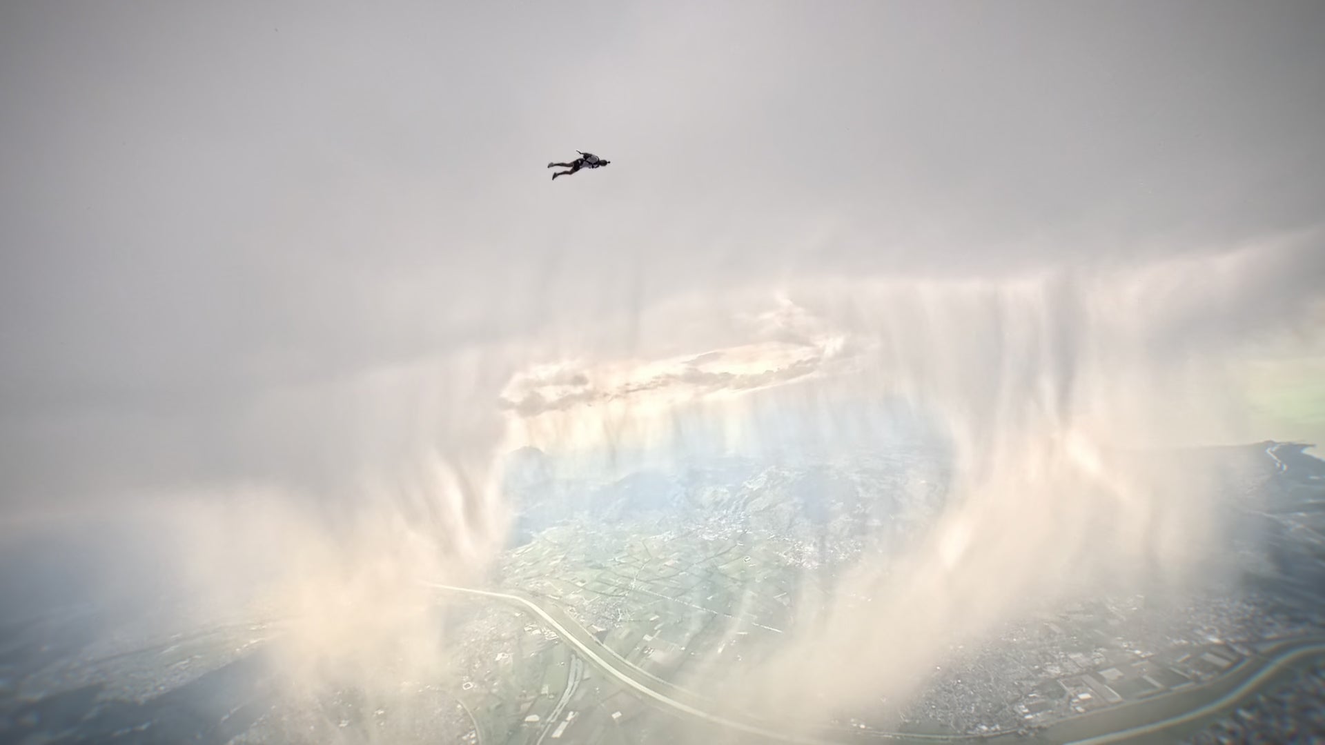Skydivers soar right next to a massive wall of hail in the Alps