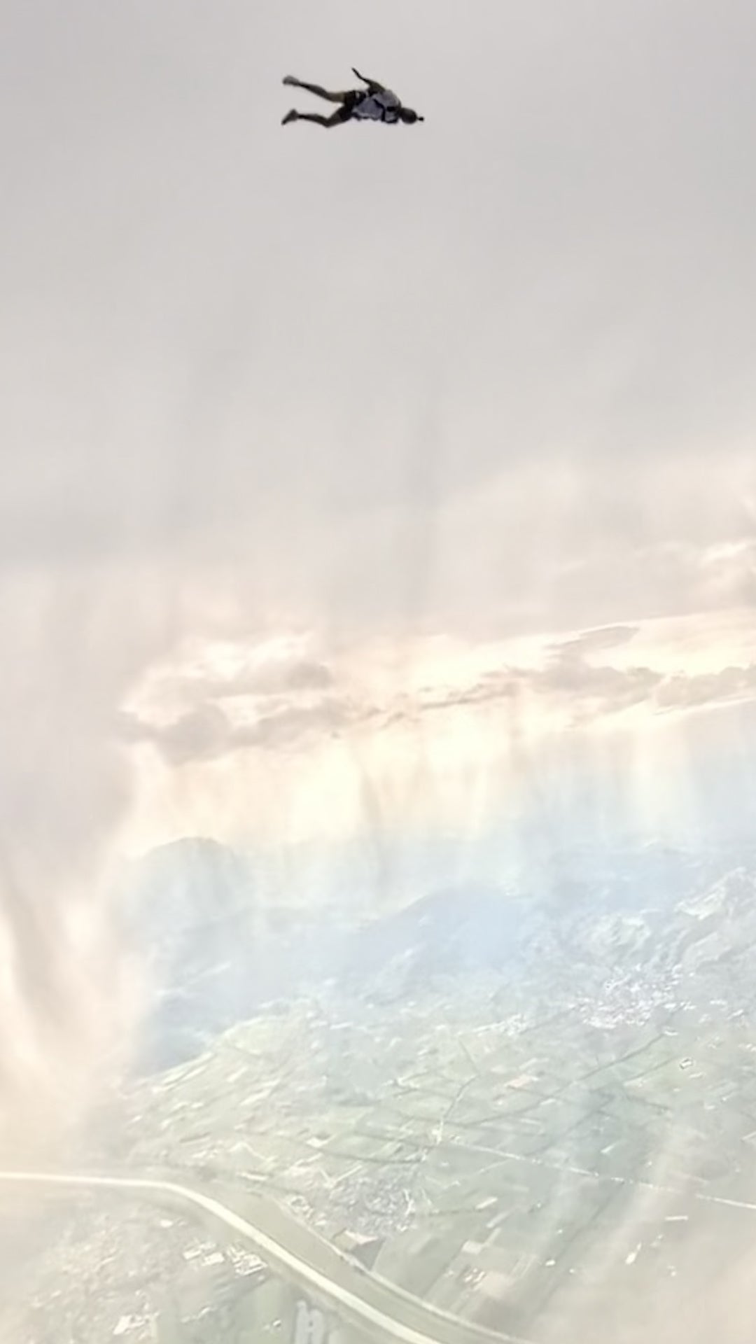 Skydivers soar near hailstorm