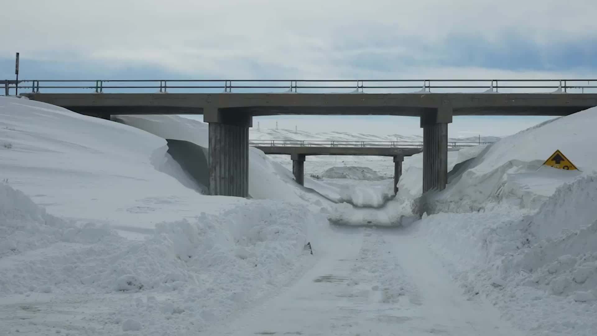 Snow Drifts Create A Highway To Nowhere In Wyoming