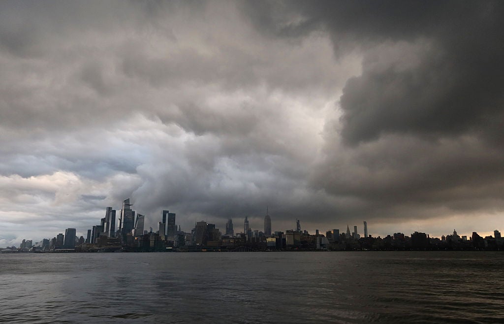 Storm clouds over the Manhattan skyline at sunrise. Behind every rain percentage sit two figures your app never shows you.