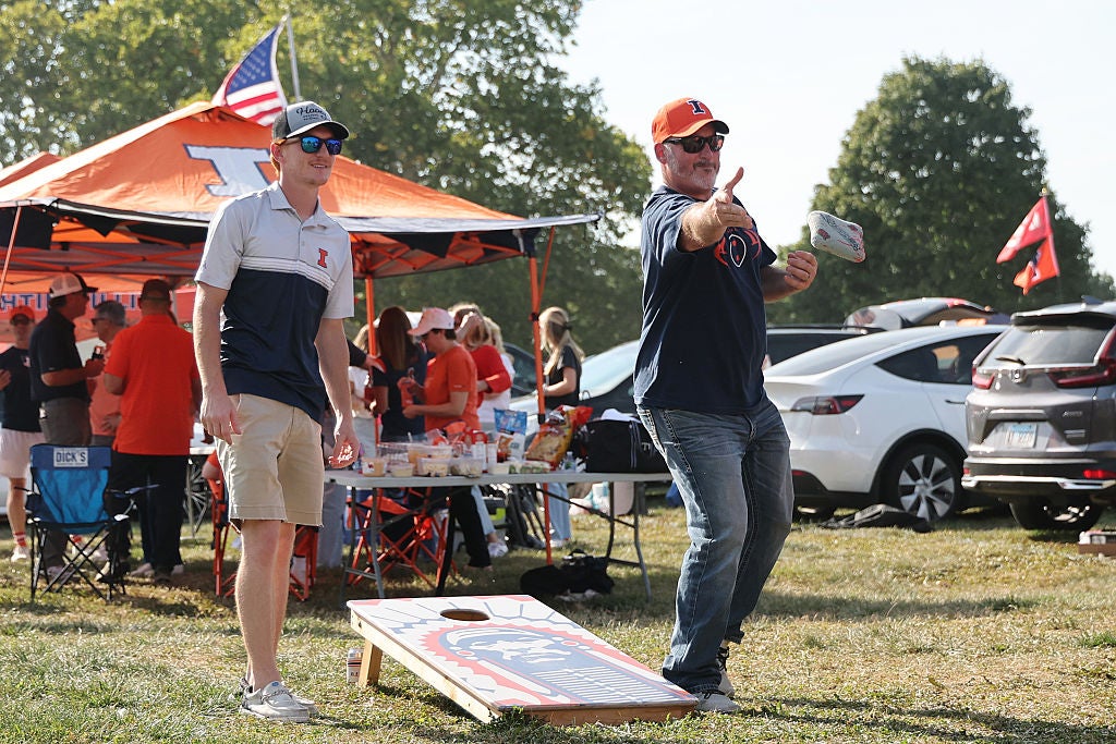 Fans enjoying tailgating activities 