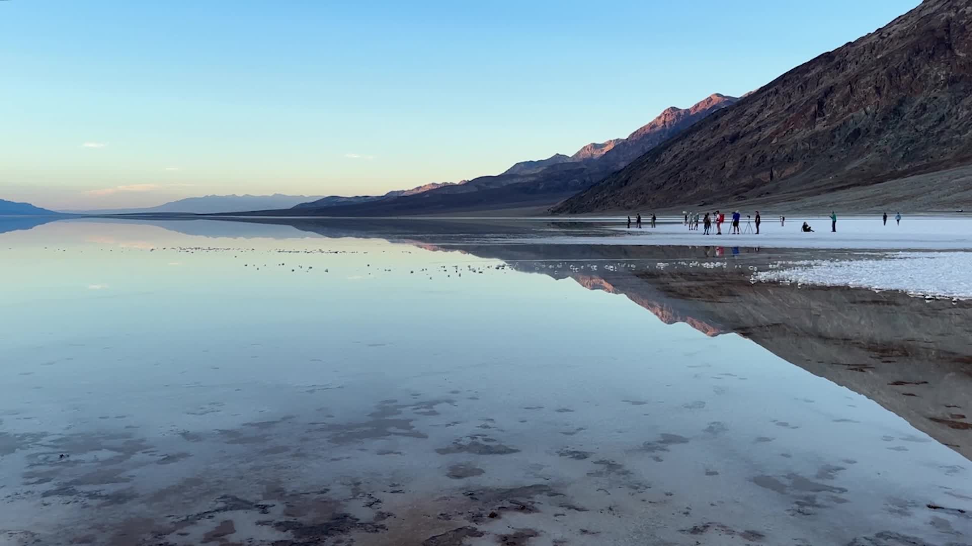 Tourists Visit Temporary Lake At Death Valley National Park