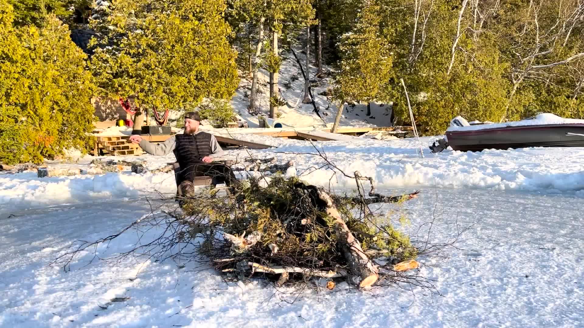 Two Friends Sit On Spinning Ice Disk On Canada Lake