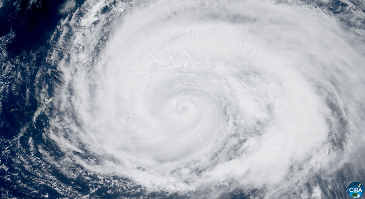 Satellite image of a large spiral cyclone with a visible eye swirling over the ocean