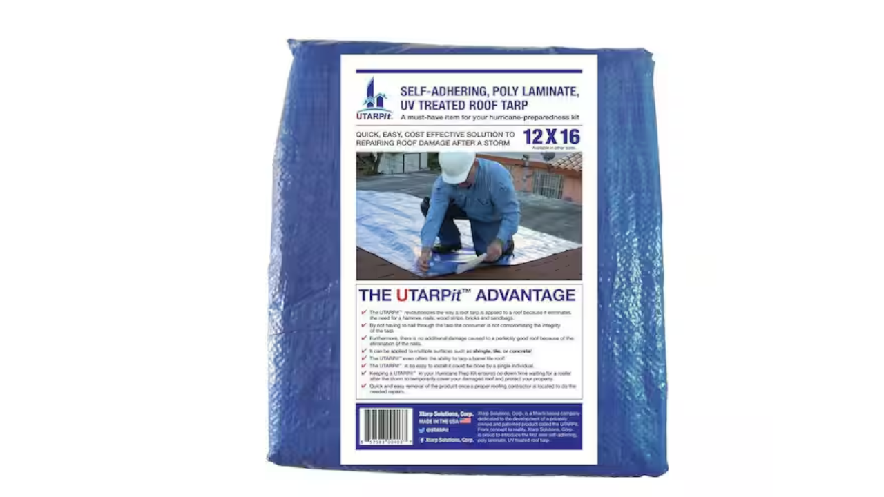 Blue packaged roof tarp with a label showing a worker installing it and the text 12x16