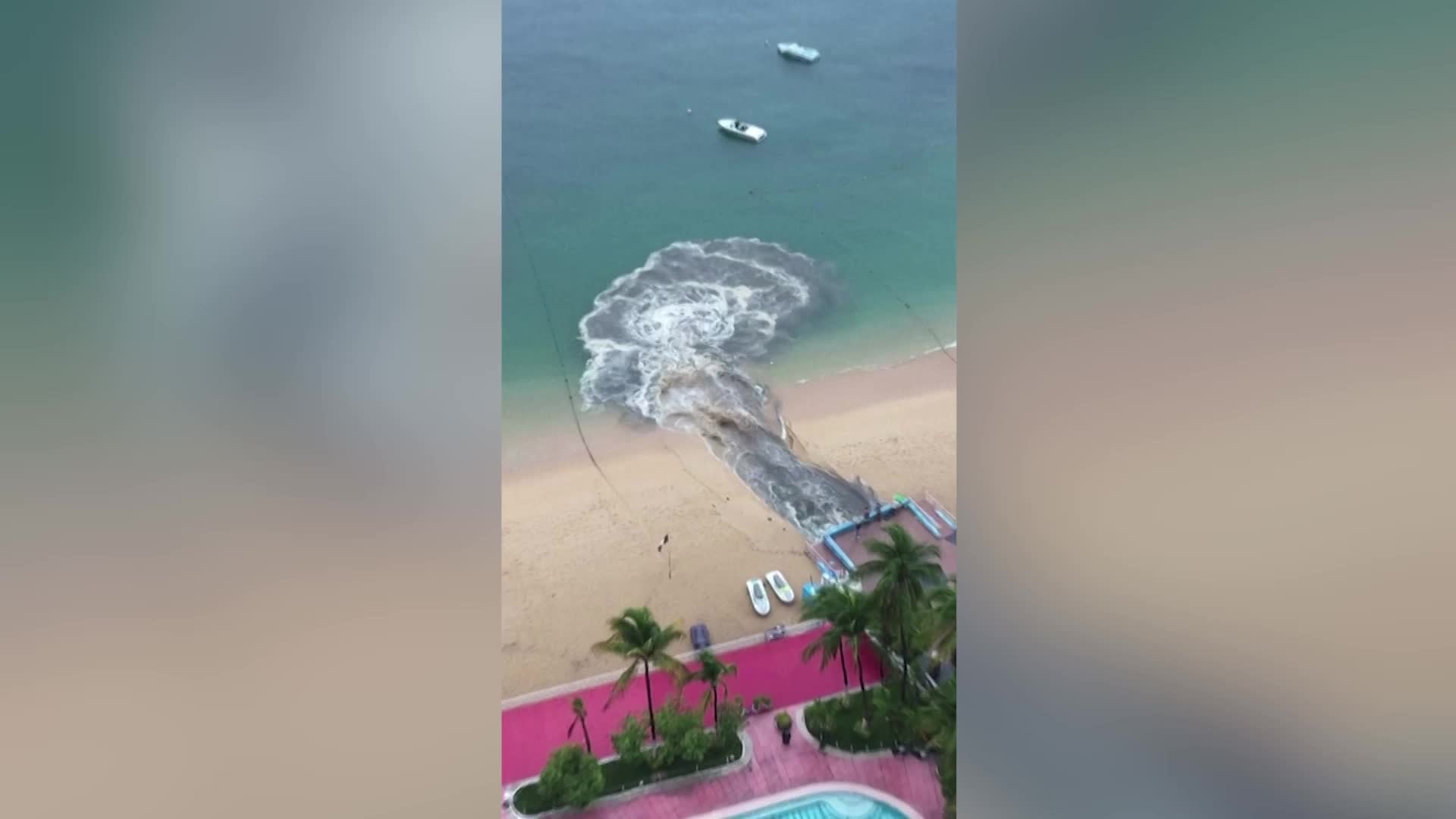 Watch Black Water Pour Onto Popular Mexico Beach