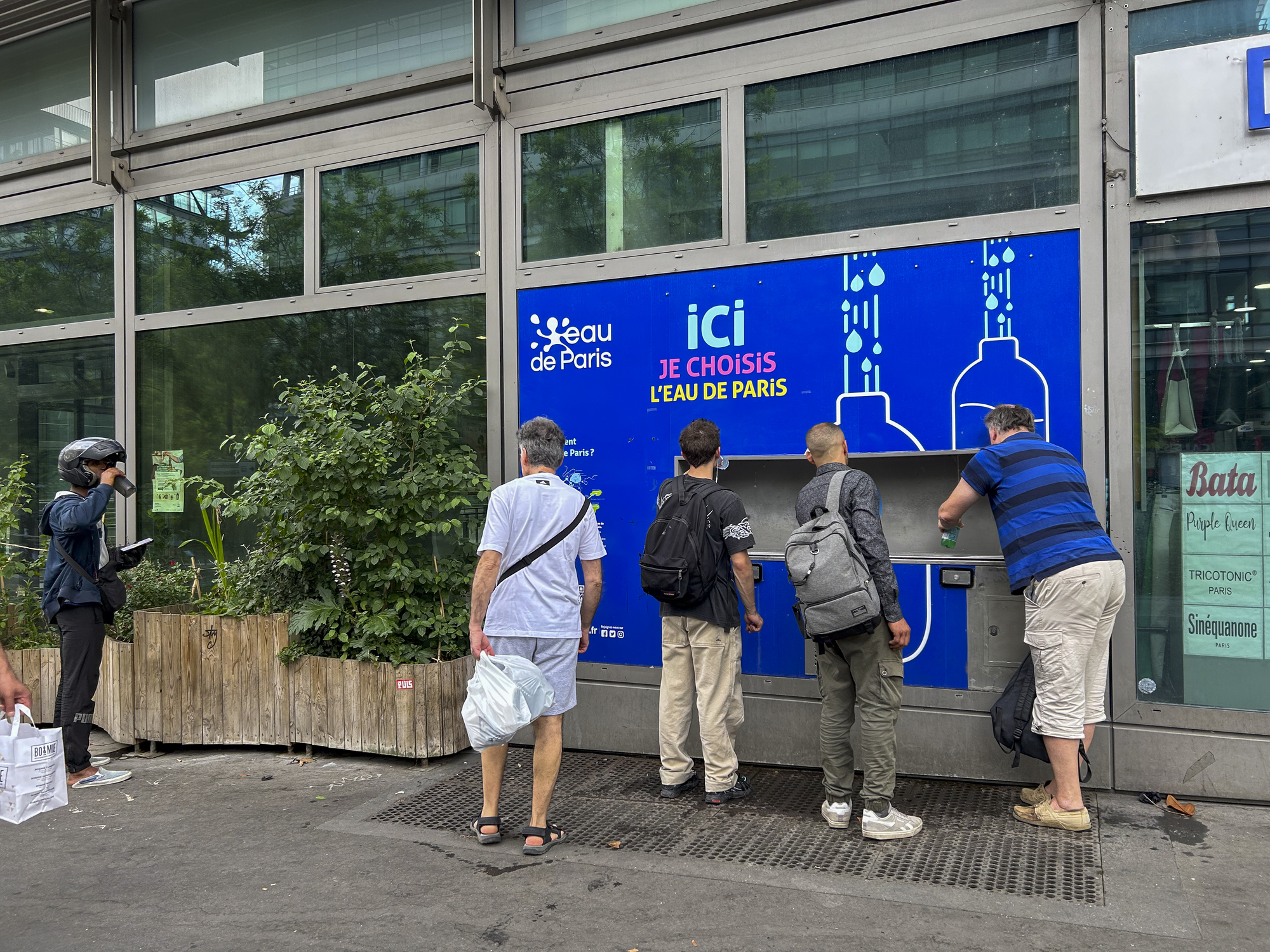Paris, France, Group of Men Getting Free Water from City Fountain, during Heat Wave - stock photo