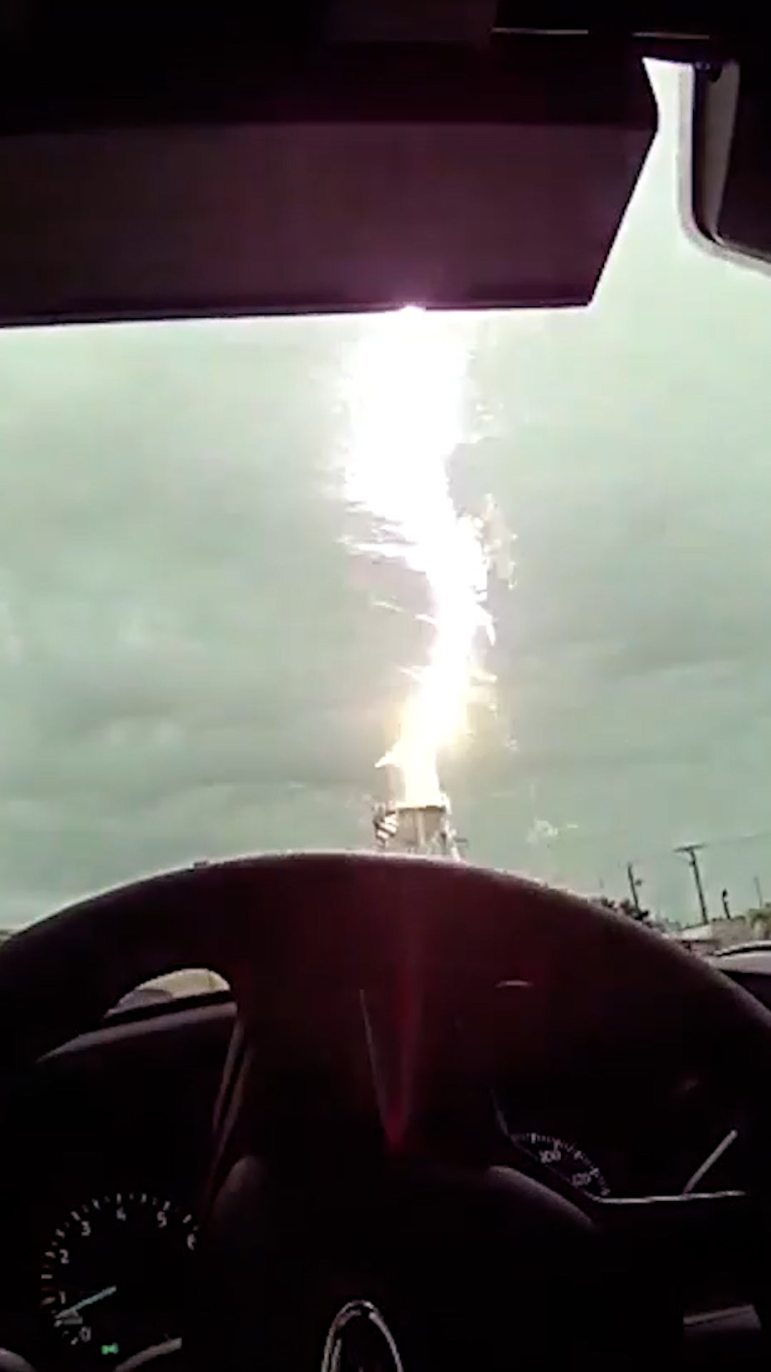 Bodycam catches lightning striking water tower