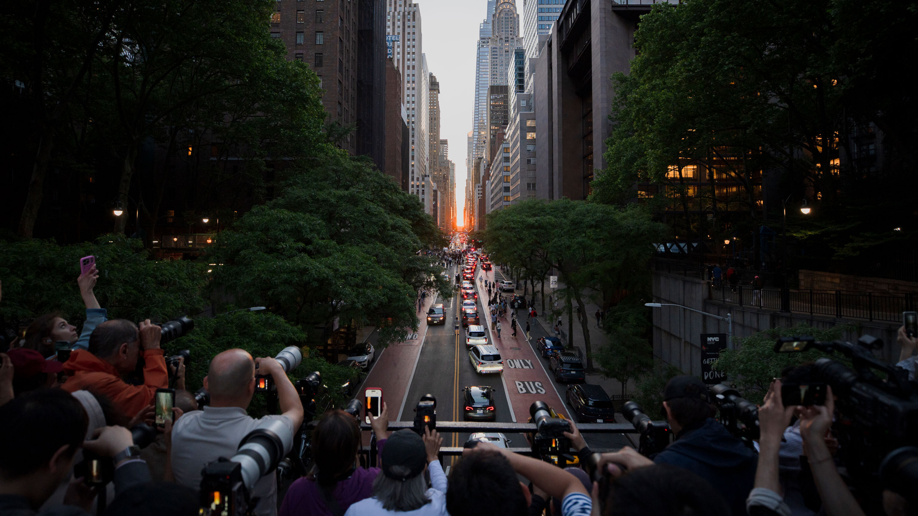 New Yorkers gather on 42nd Street near Times Square to see the "Manhattanhenge" solar spectacle on May 28, 2026, in New York City.