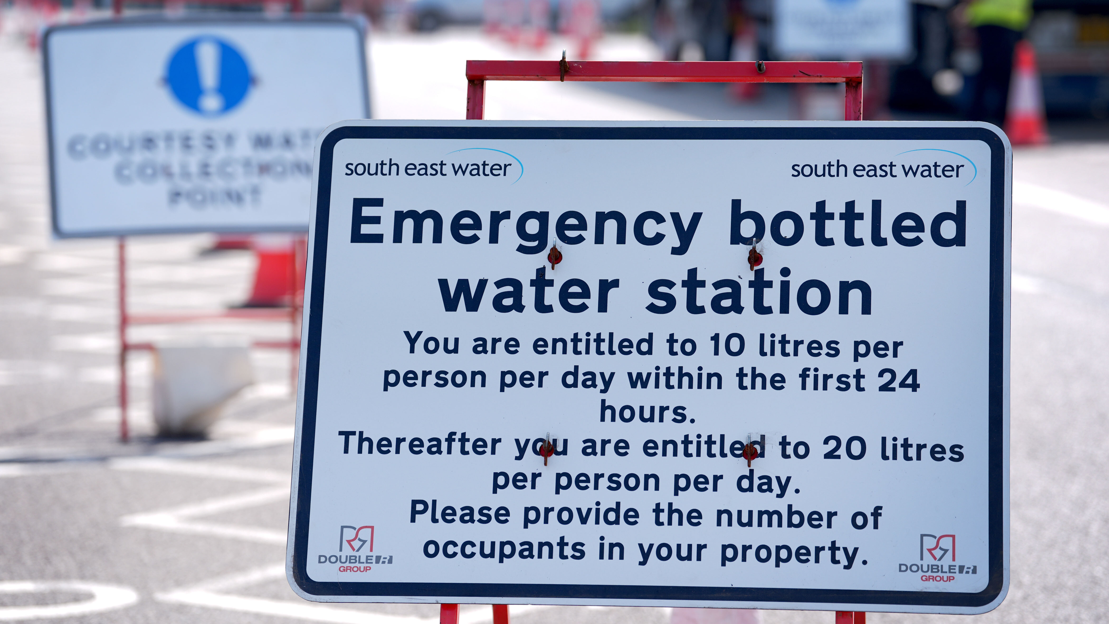 Bottled water is handed out at a water collection point near Herne Bay in Kent on May 30, 2026. Some areas of Kent and Sussex are experiencing water supply disruptions due to the hot spell, with storage reservoirs at critical levels in Whitstable and Herne Bay.