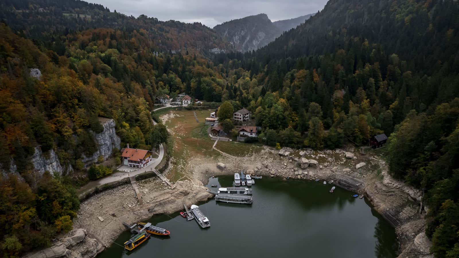 This aerial photograph shows the remaining basin in the northern part of Lake Brenets, part of the Doubs River forming a natural border between eastern France and western Switzerland, which dried up in July 2026, in Les Brenets, Switzerland, on Oct. 1, 2026.