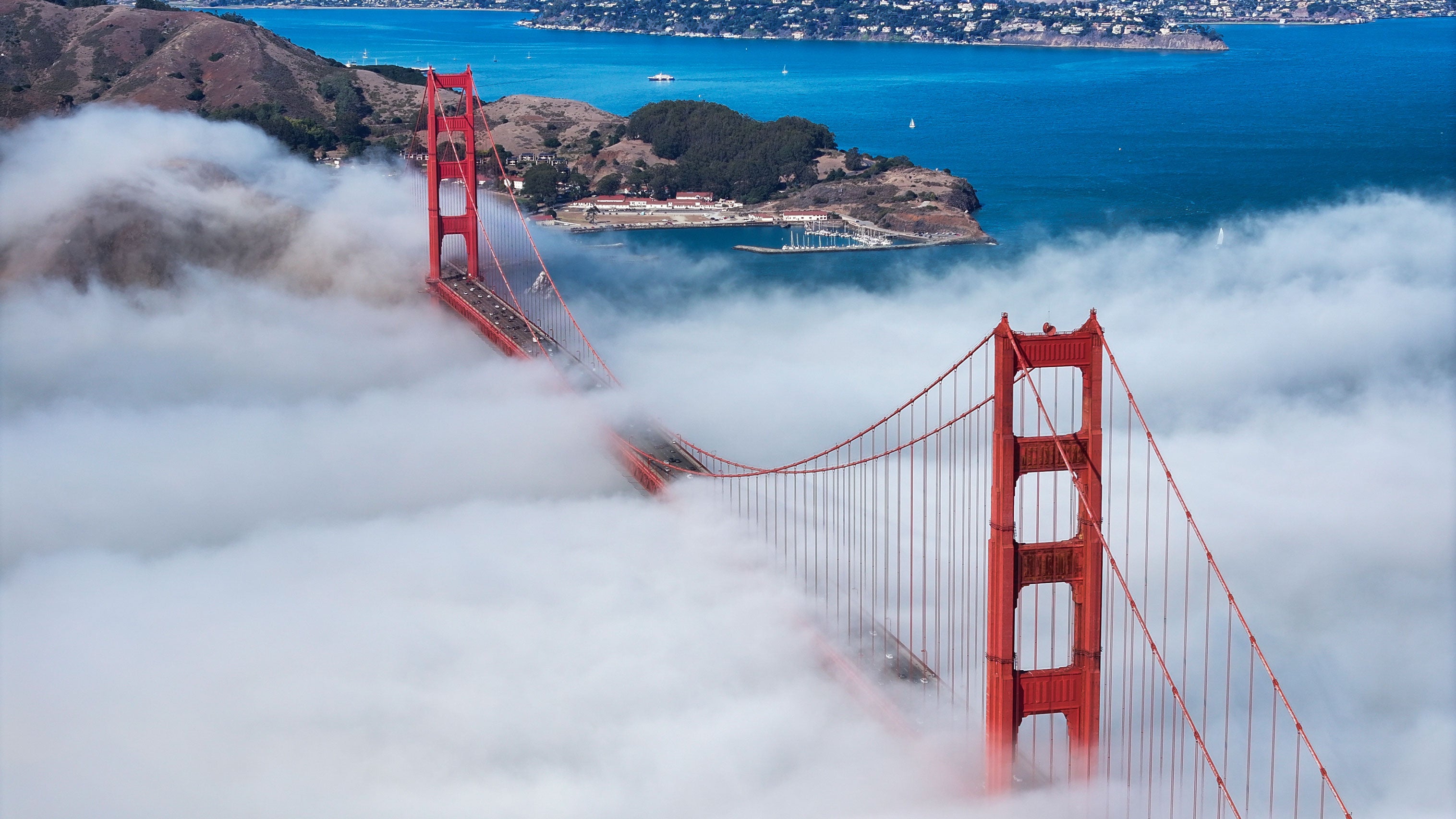 Dense fog blankets the Golden Gate Bridge in San Francisco, California, United States, on Oct. 6, 2026. The Golden Gate Bridge, one of San Francisco's most recognizable landmarks, is frequently surrounded by dense fog due to the city's coastal climate and cool Pacific air, creating picturesque scenes.