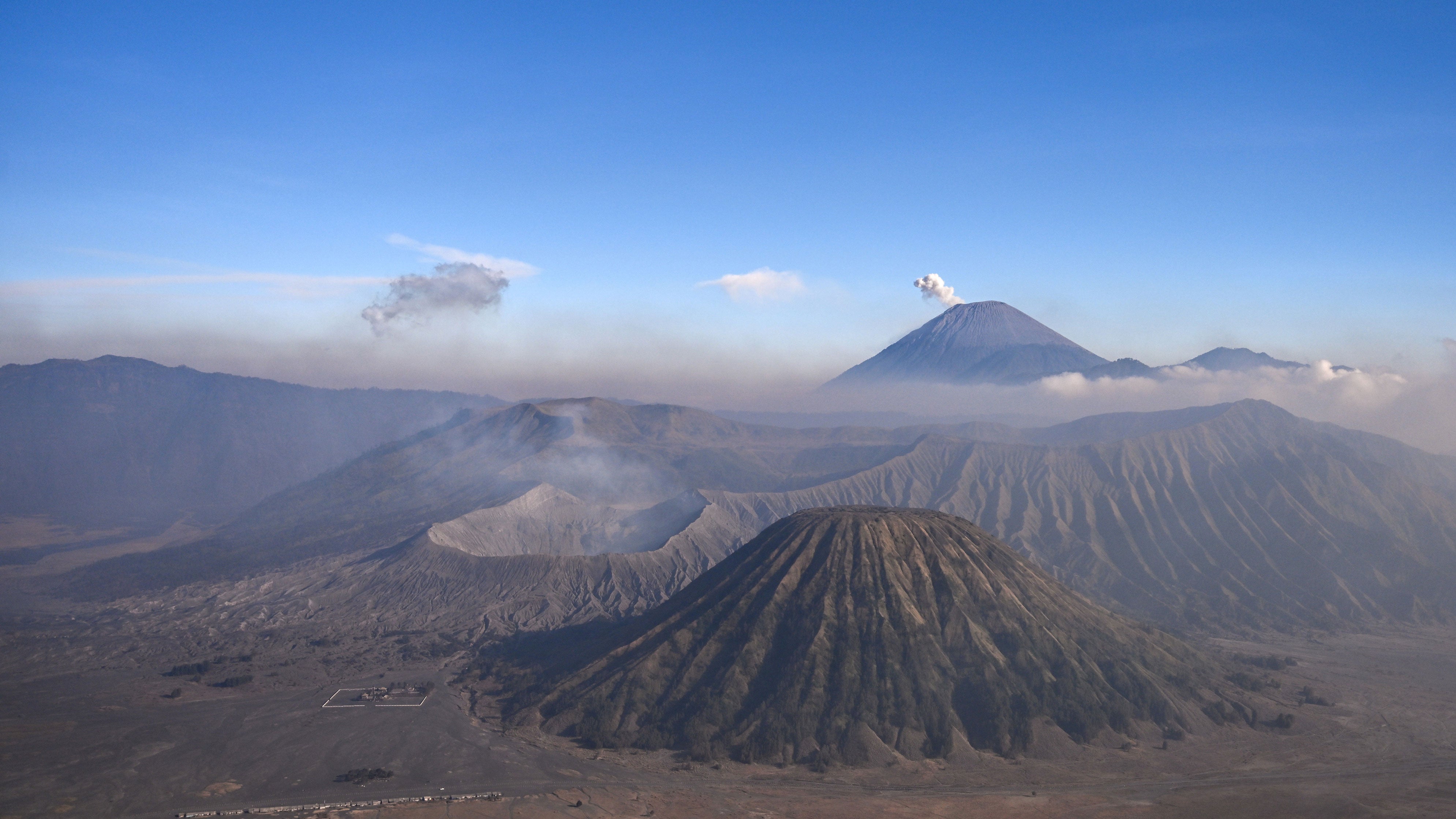 A view of the Bromo Tengger Semeru National Park as seen from the summit of Mount Penanjakan in Pasuruan, East Java, on Thursday, Aug. 13, 2026. Indonesian firefighters backed by helicopters and drones battled devastating flames for an eighth day on Aug. 10 in a national park on Java Island where over 1,235 acres have been lost.