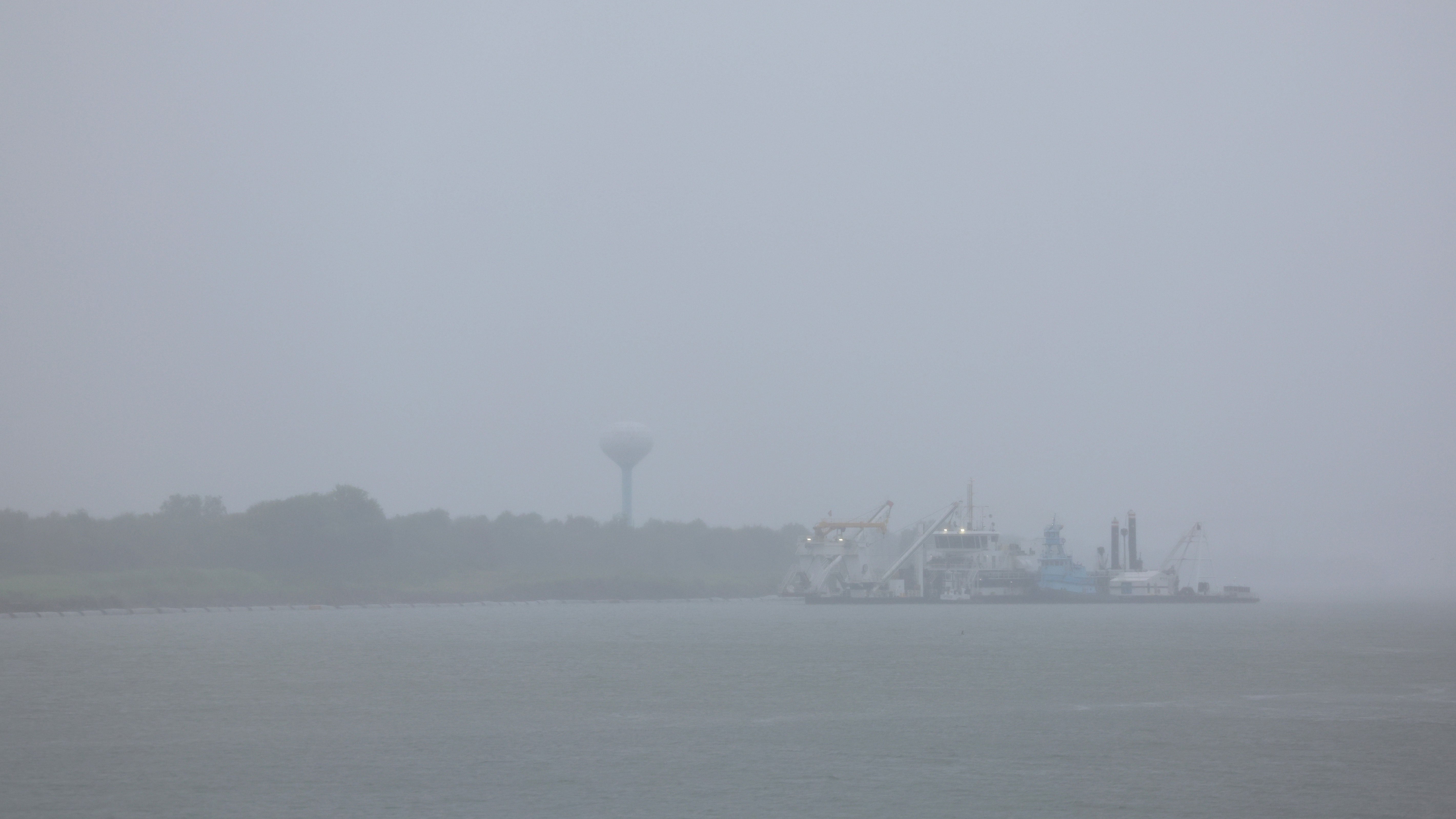 Boats sit anchored in Port Arthur, Texas as Tropical Storm Edouard makes landfall on Tuesday, Sept. 1, 2026. Edouard, the fifth named storm of the Atlantic hurricane season, was expected to bring heavy rain along the upper Texas coast.