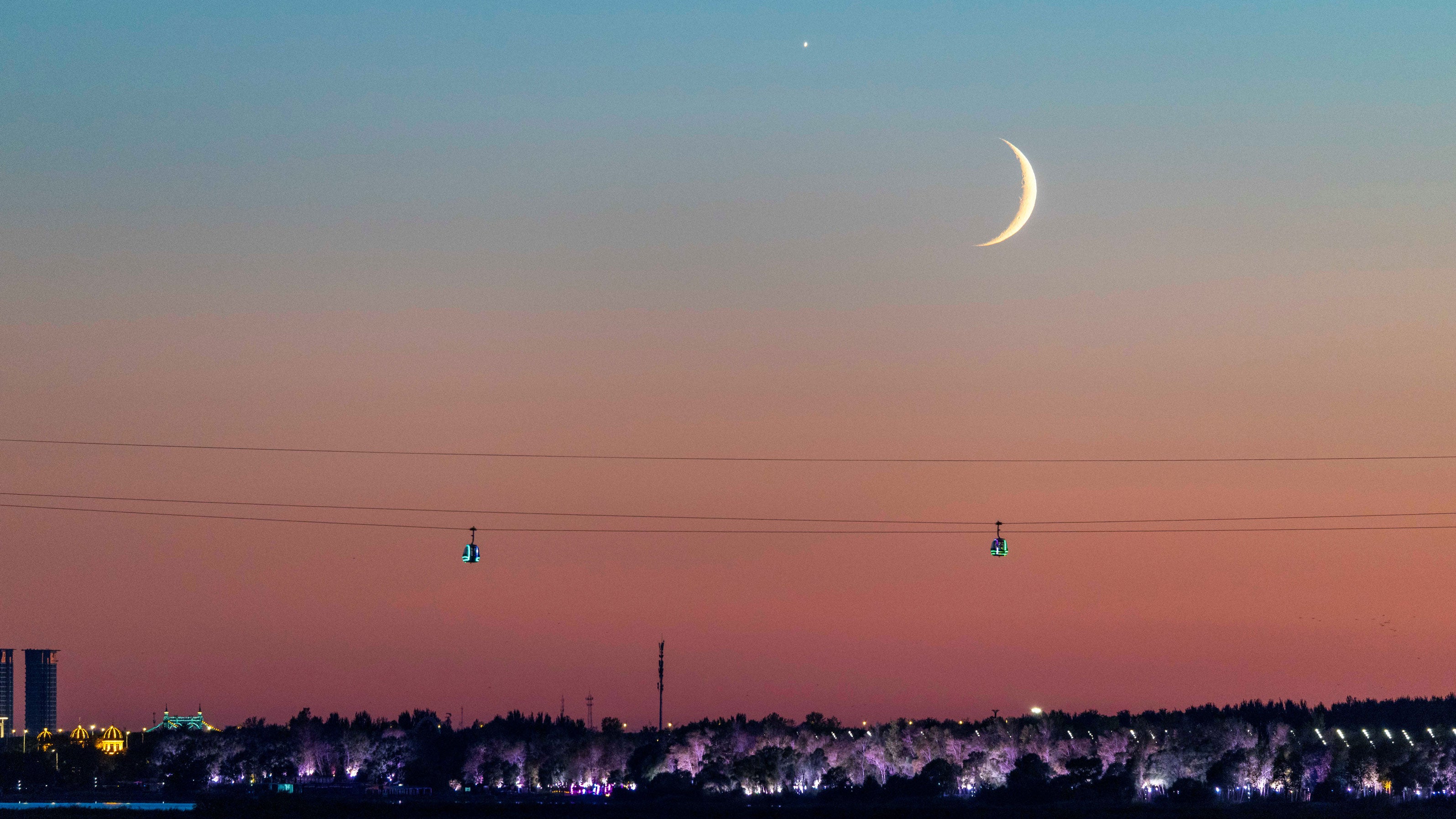 This photo taken on Sept. 14, 2026, shows the planet Venus next to the moon in the sky over Harbin City, Heilongjiang Province, China.