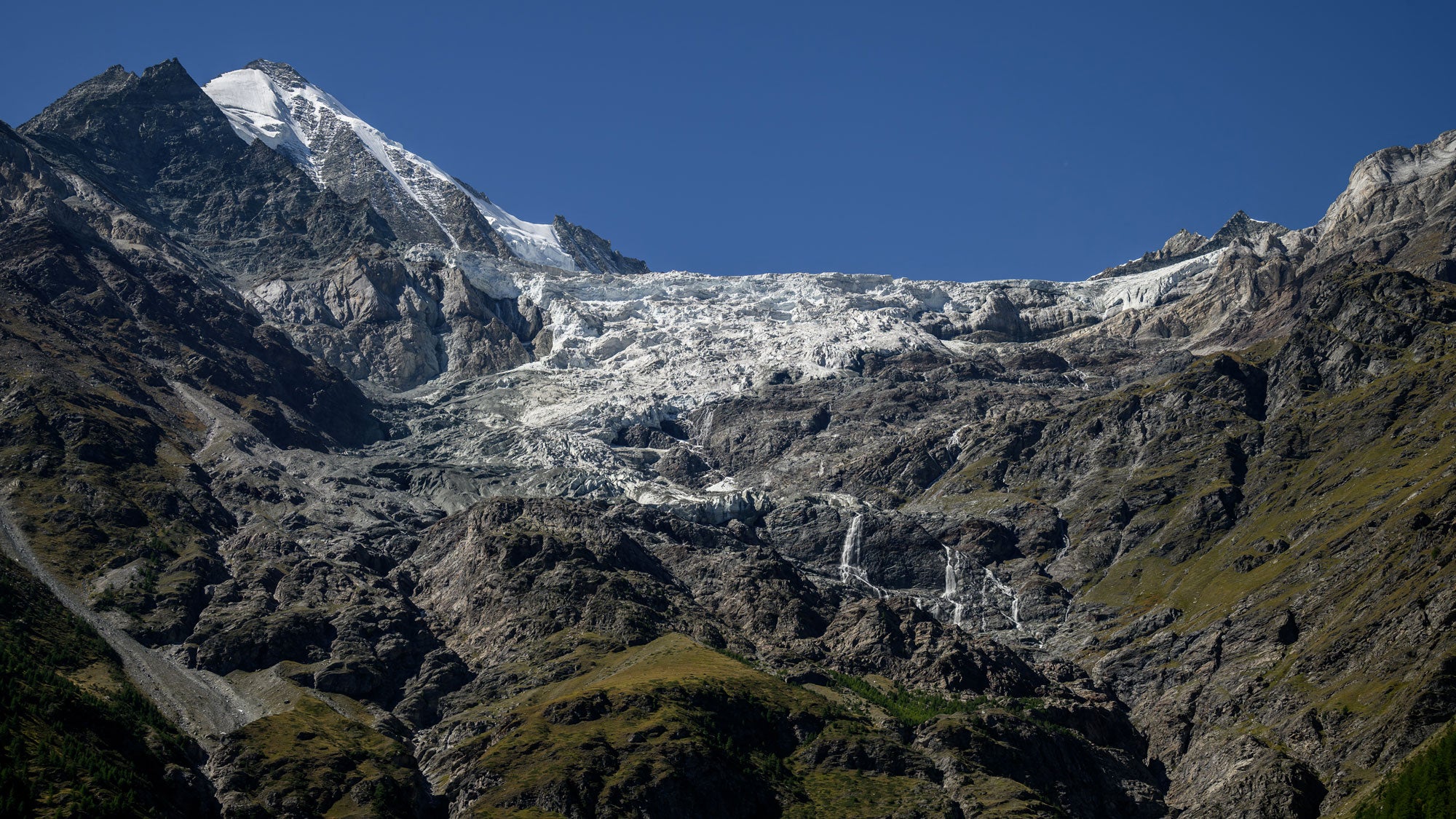 The Weisshorn's east side glacier where local authorities have increased the alert level following multiple ice break-offs, above Randa, southwestern Switzerland, on Sept. 15, 2026. Officials continue to monitor the unstable slope and have restricted access to the designated hazard zone amid concerns over further collapses.
